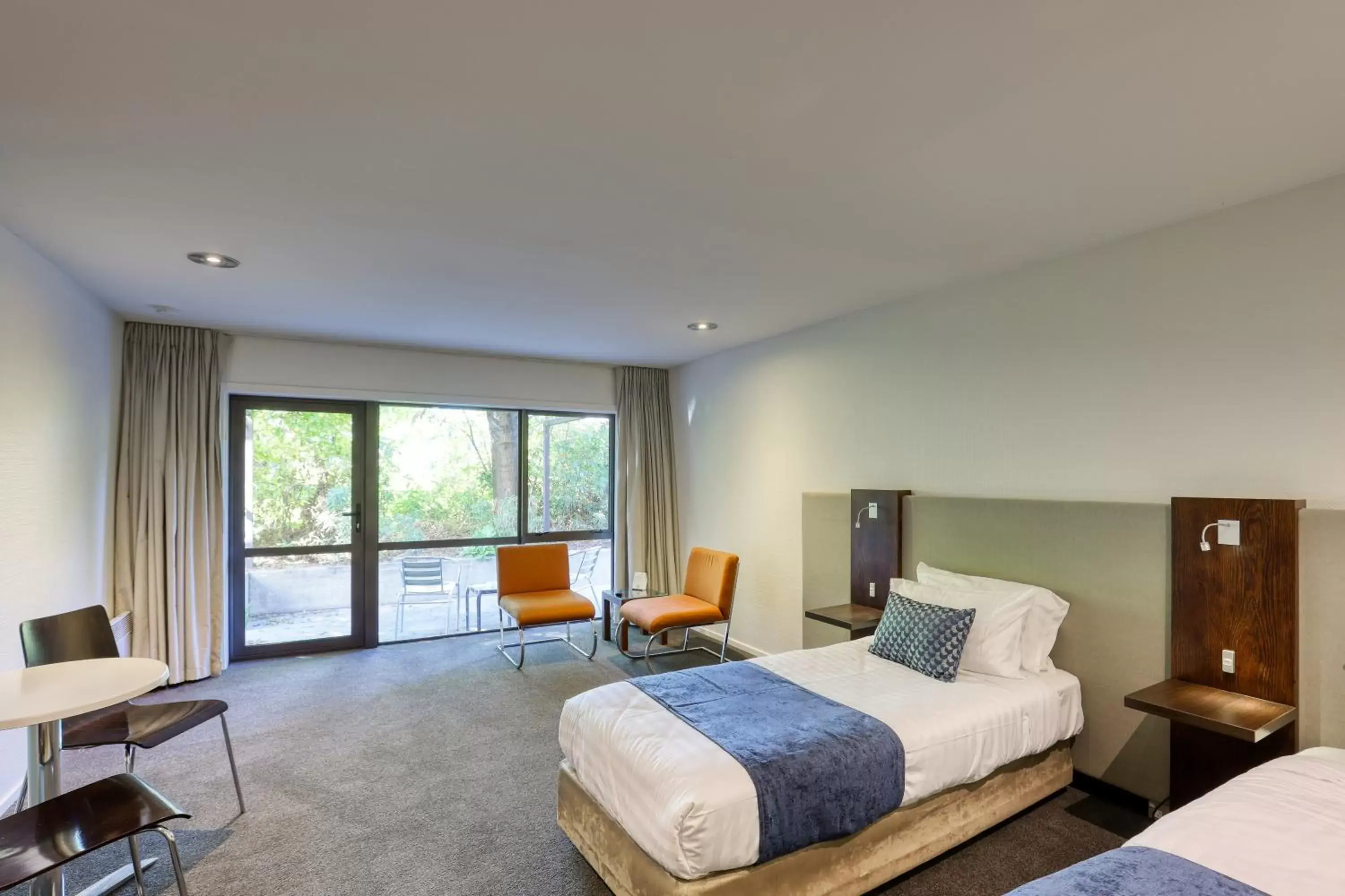 Bedroom in Garden Court Suites & Apartments