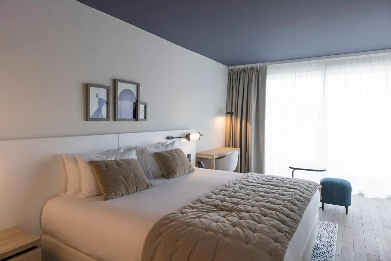 Bed in Hotel Indigo Cagnes-sur-Mer, an IHG Hotel
