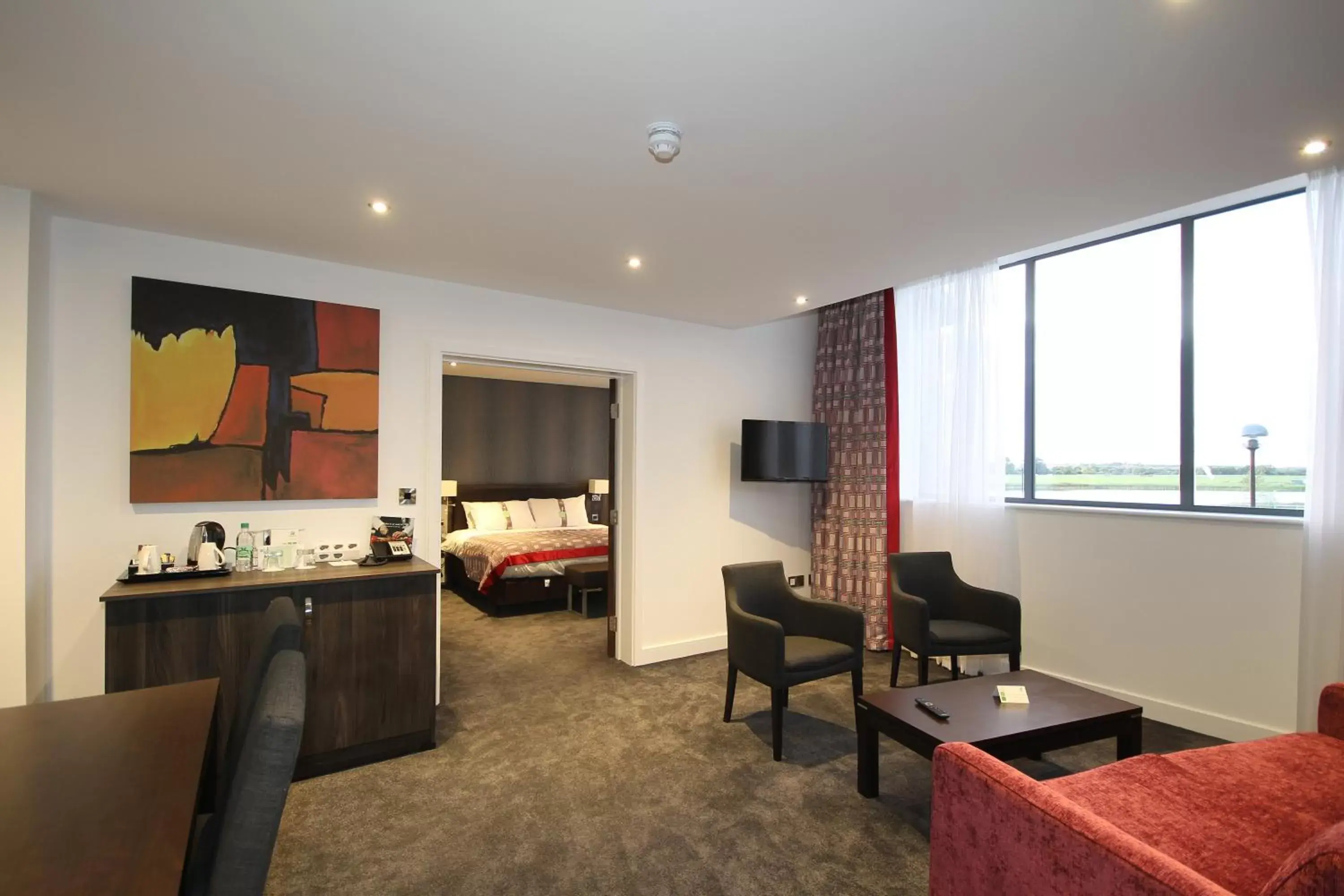 Bedroom, Seating Area in Holiday Inn Huntingdon Racecourse, an IHG Hotel