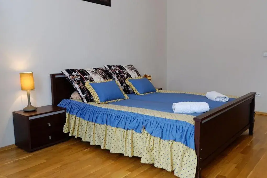 Bed in P&J Tourist Apartments