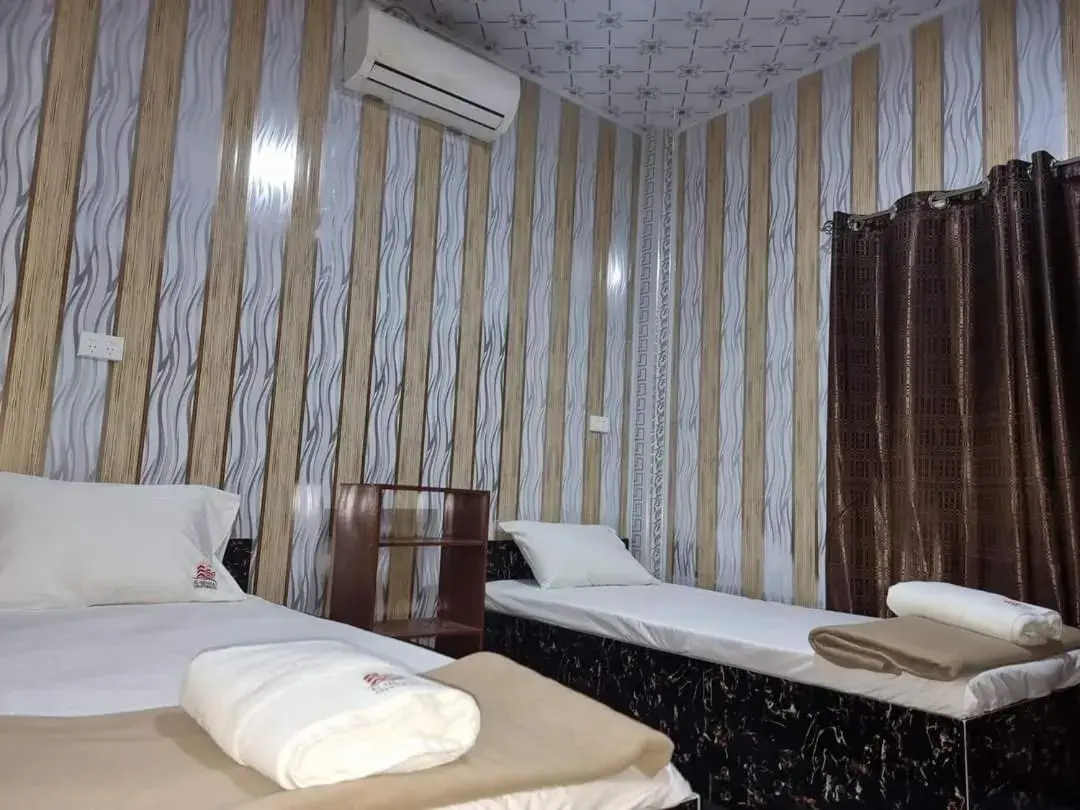 Bed in Al - Minhaj Service Apartments