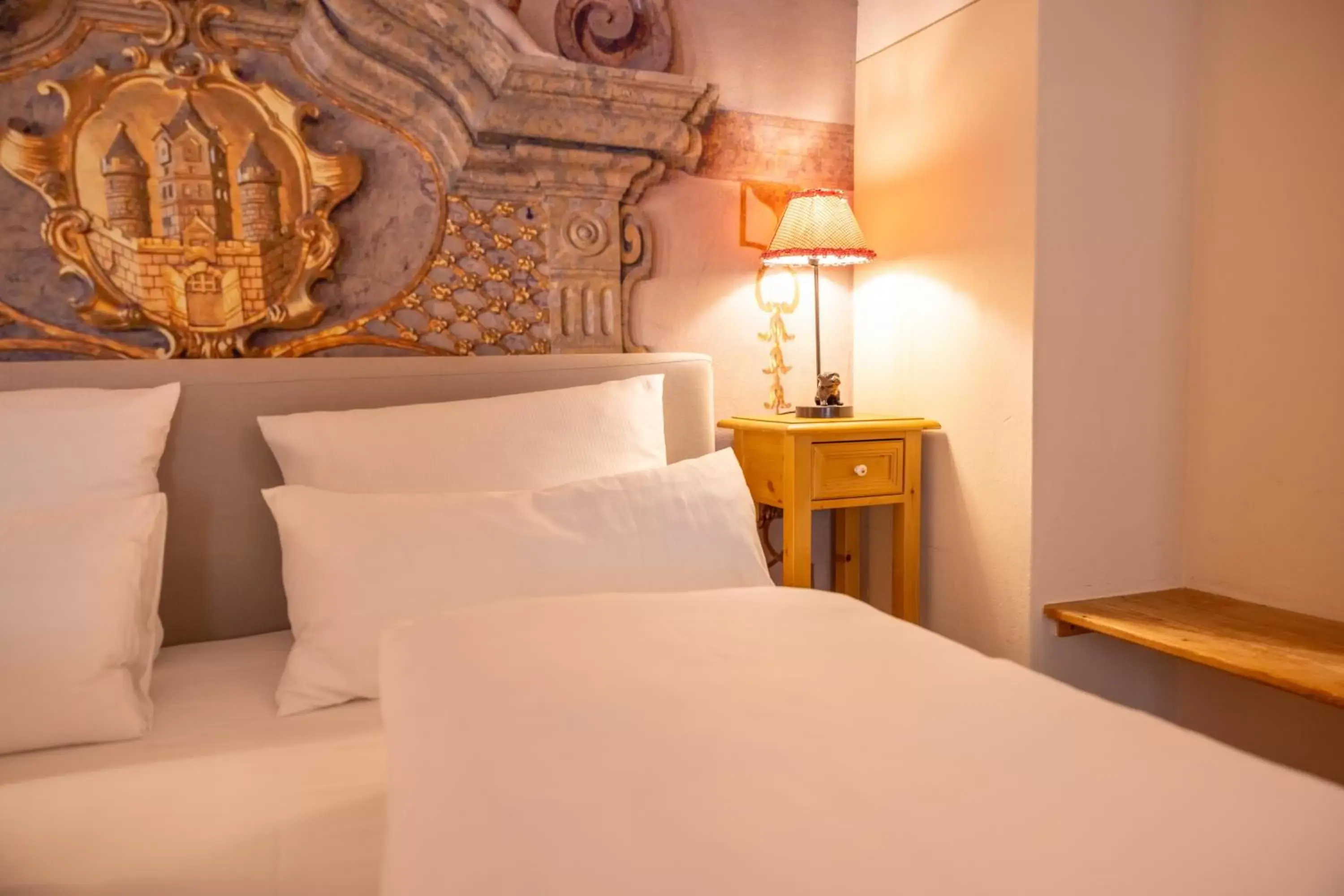 Bed in Boutiquehotel Amadeus