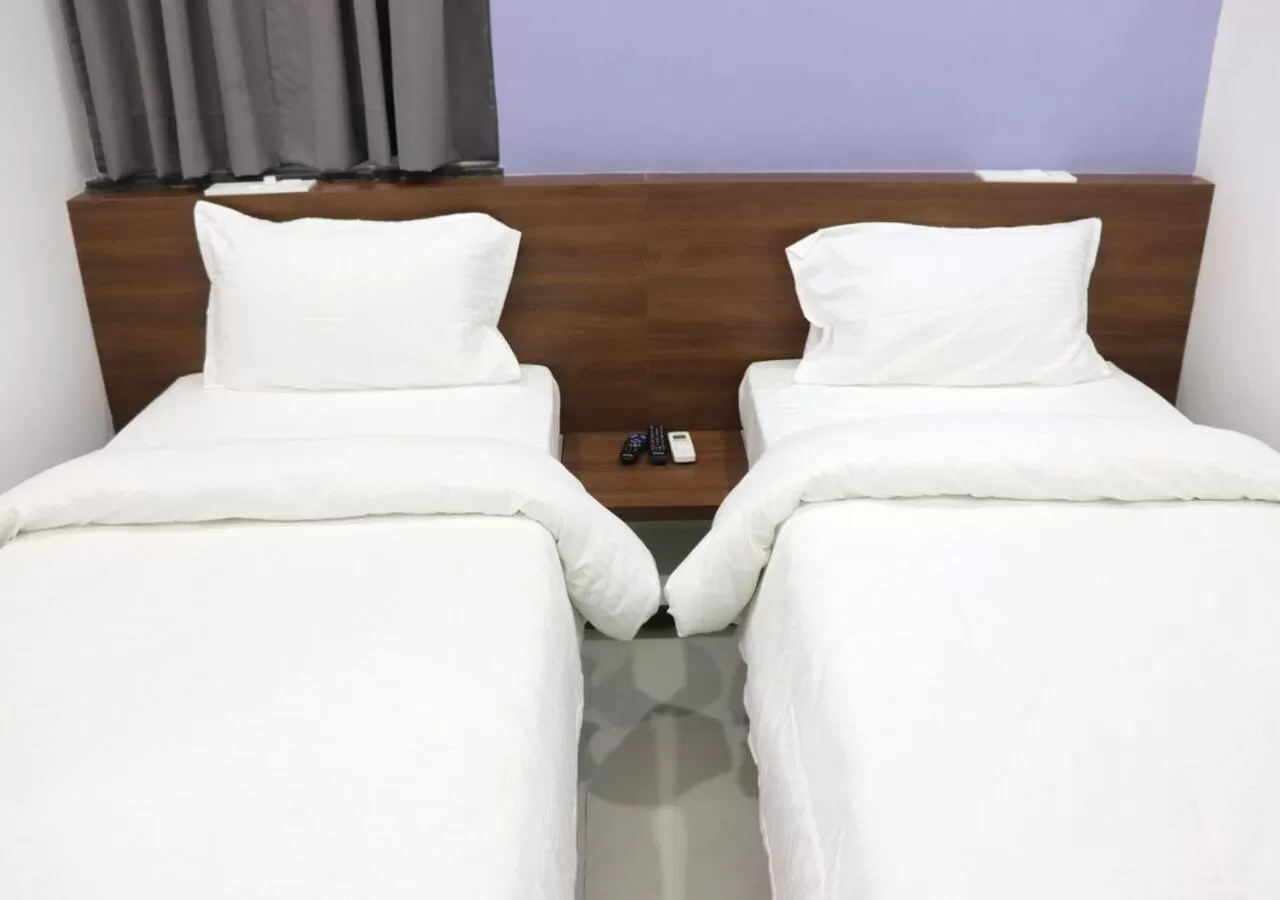 Bed in Sharman Suites