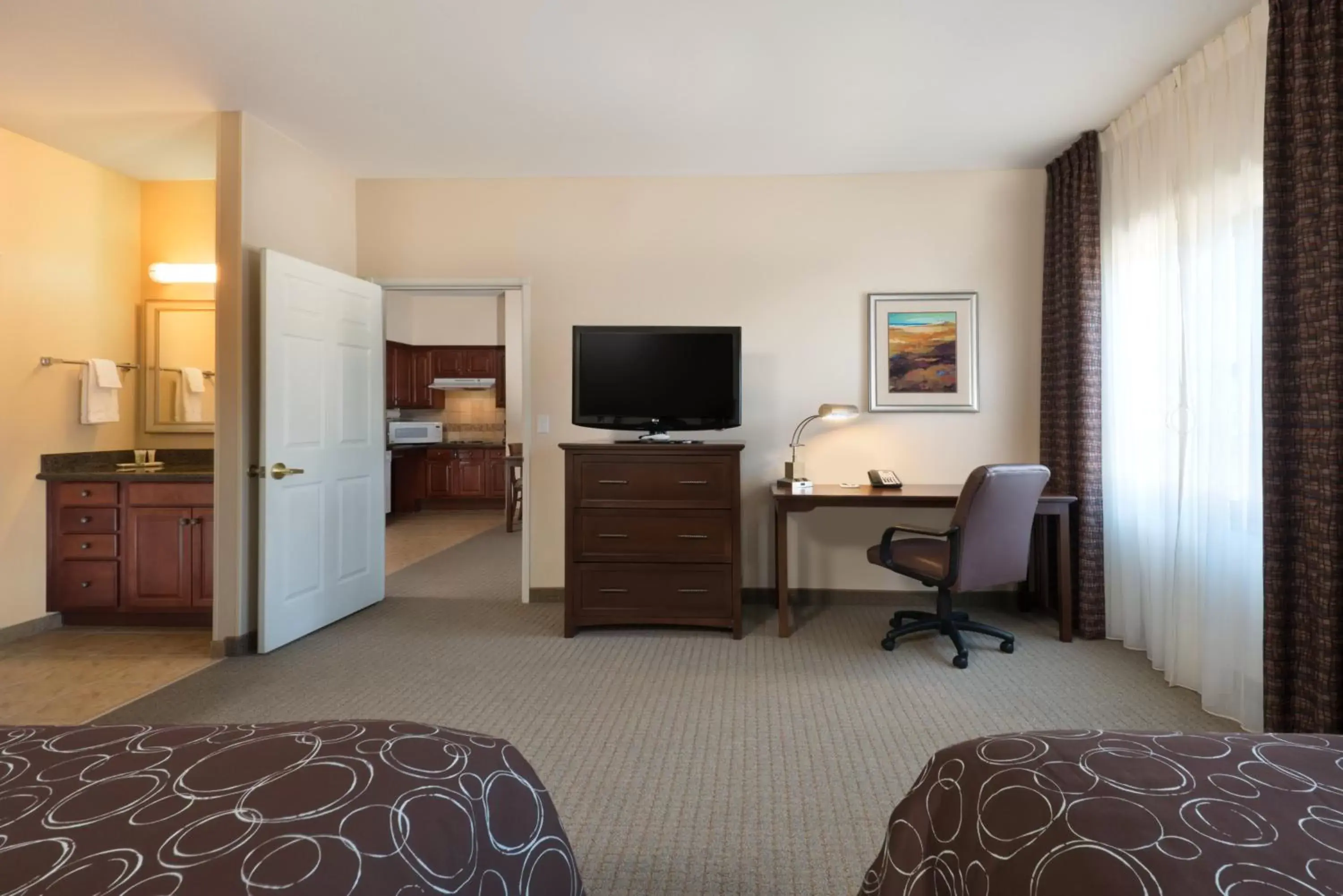 Photo of the whole room, TV/Entertainment Center in Staybridge Suites Tucson Airport, an IHG Hotel