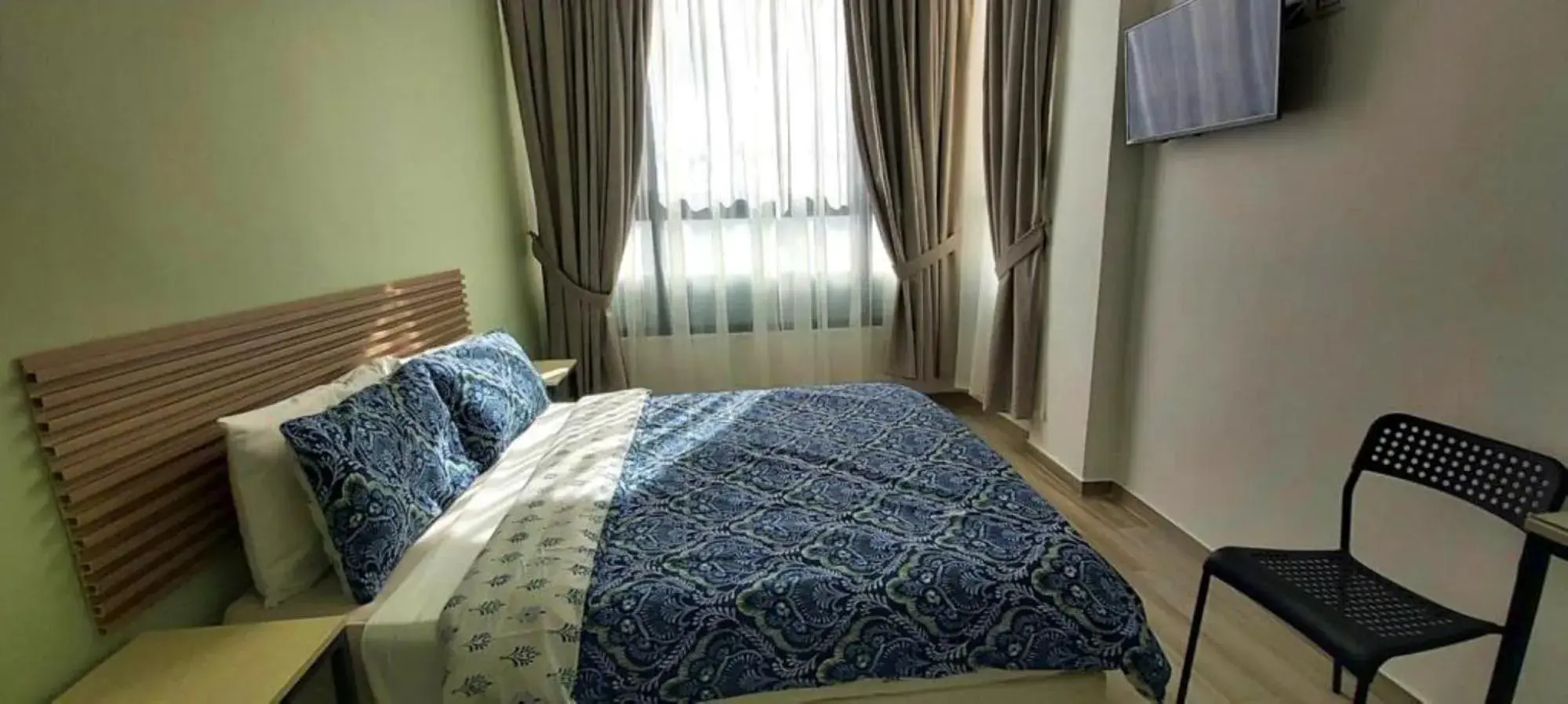 Bed in ARABESQUE HOTEL
