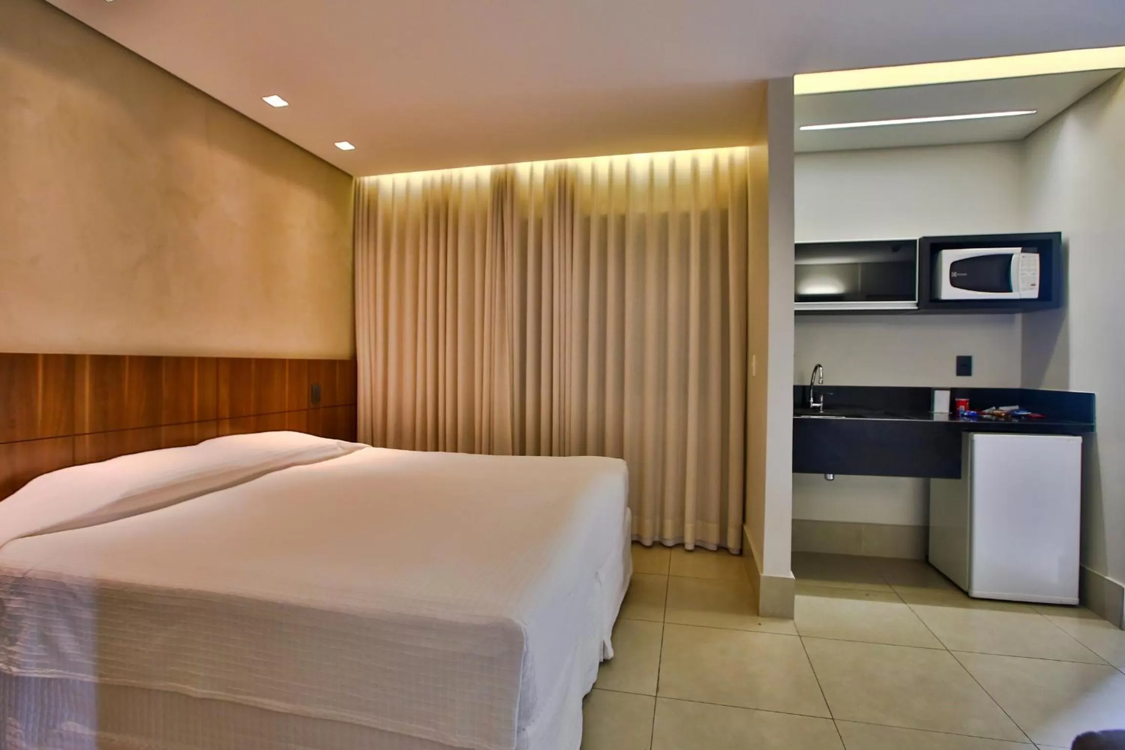 Photo of the whole room, Bed in Transamerica Belo Horizonte Lourdes