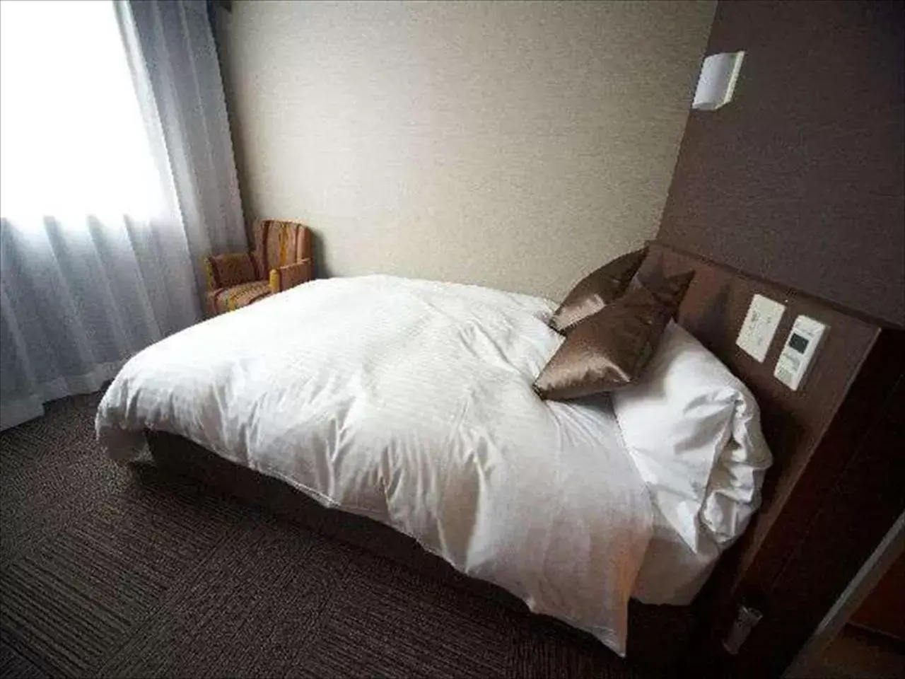 Bed in Dormy Inn Hiroshima