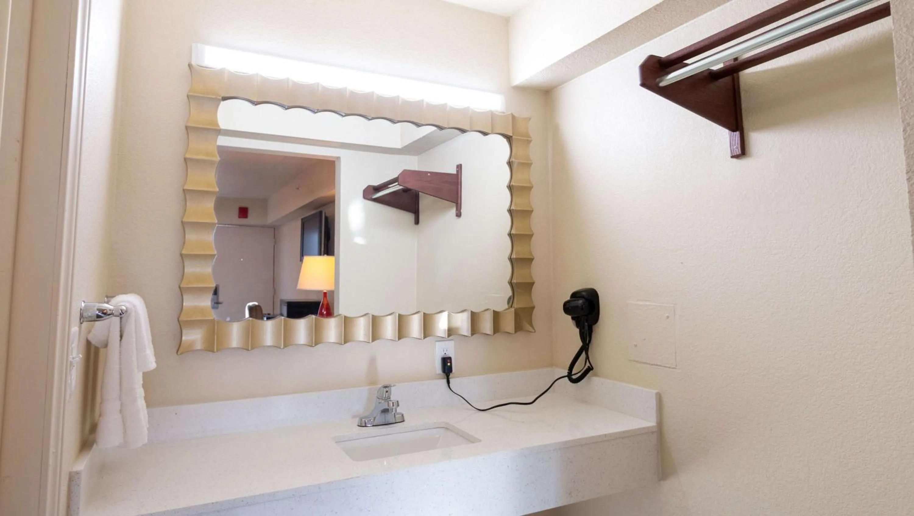 Bathroom in Magnuson Extended Stay and Suites Airport Hotel