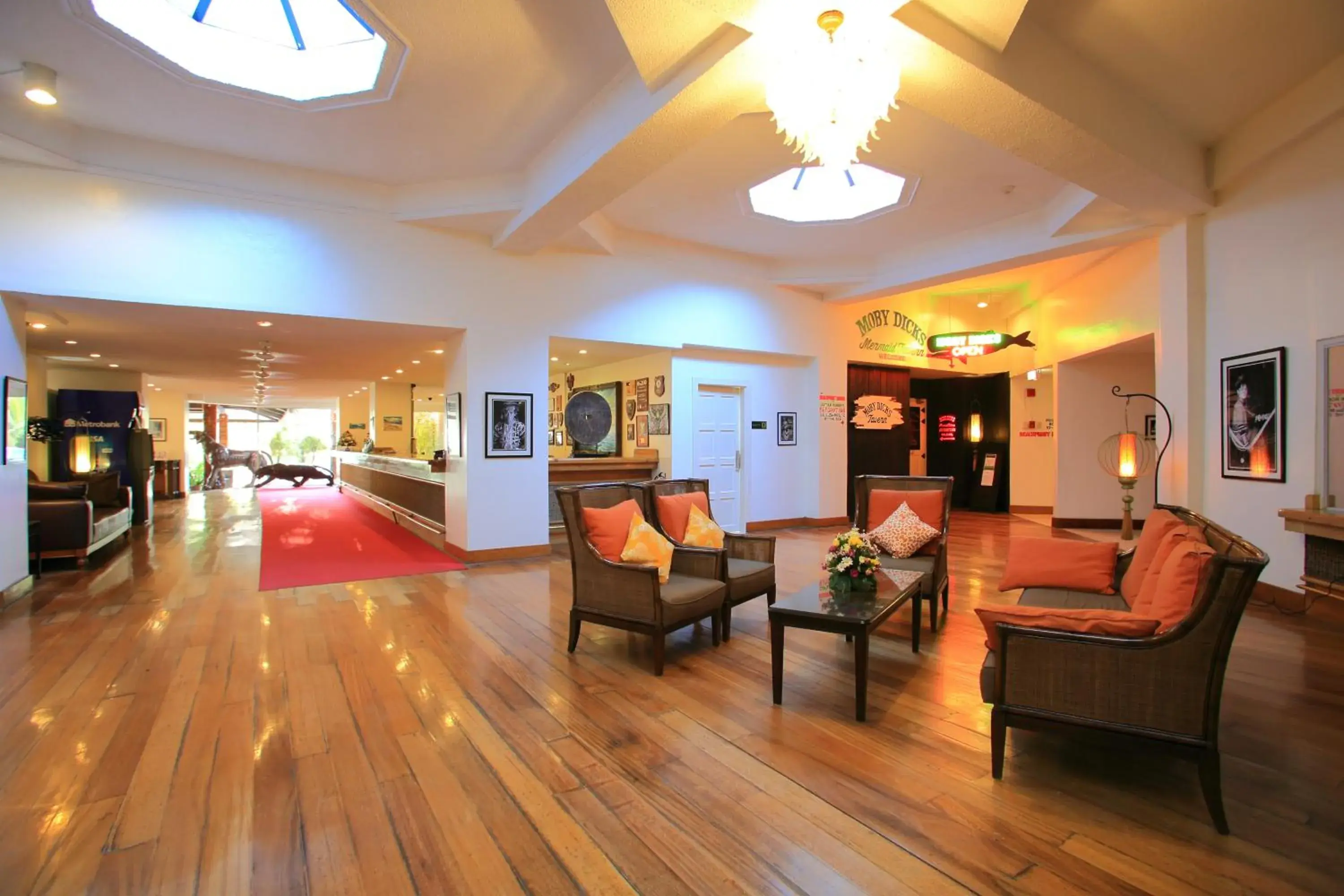 Seating area, Lobby/Reception in Wild Orchid Beach Resort