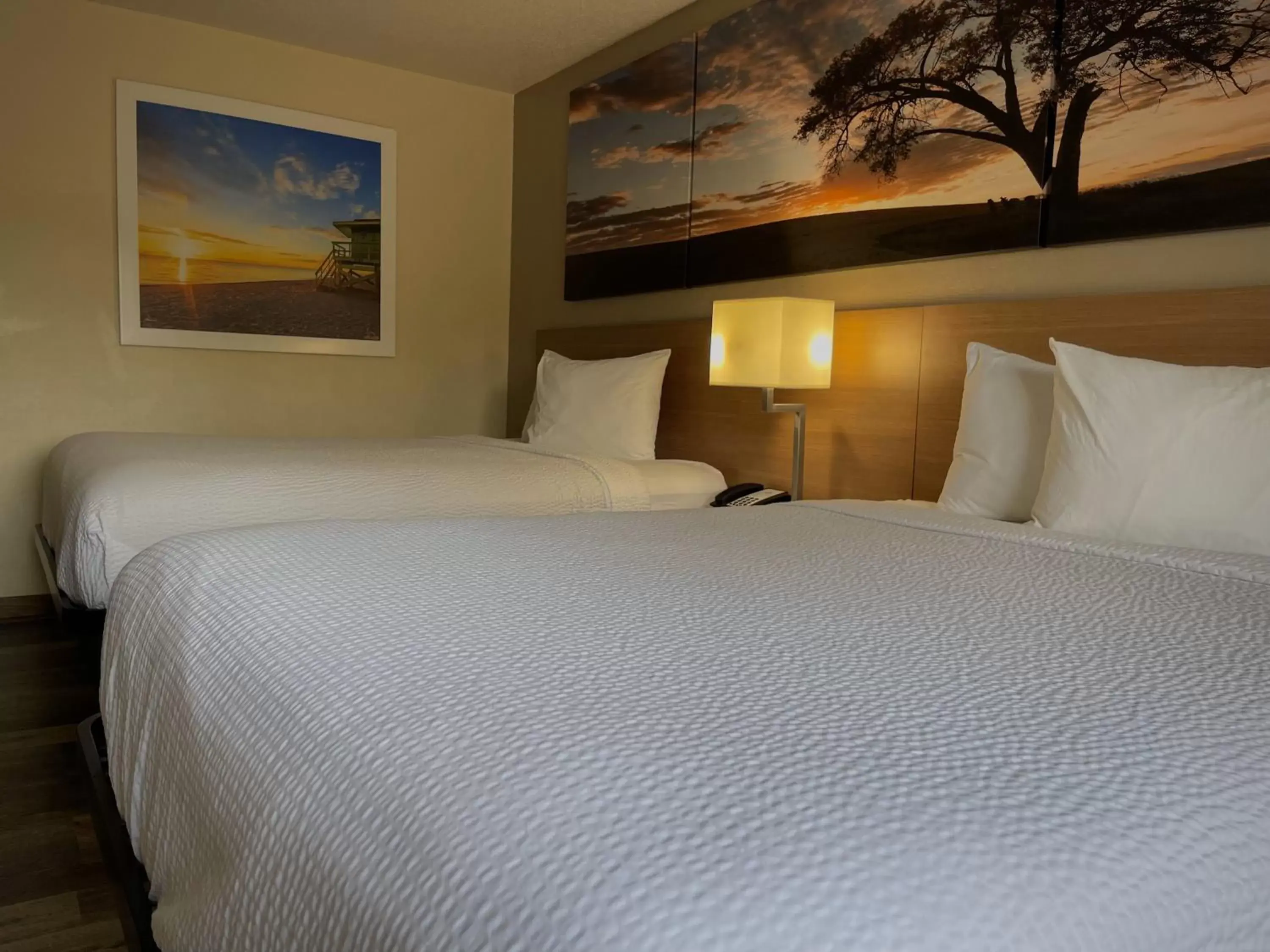 Bed in Days Inn & Suites by Wyndham Kaukauna WI