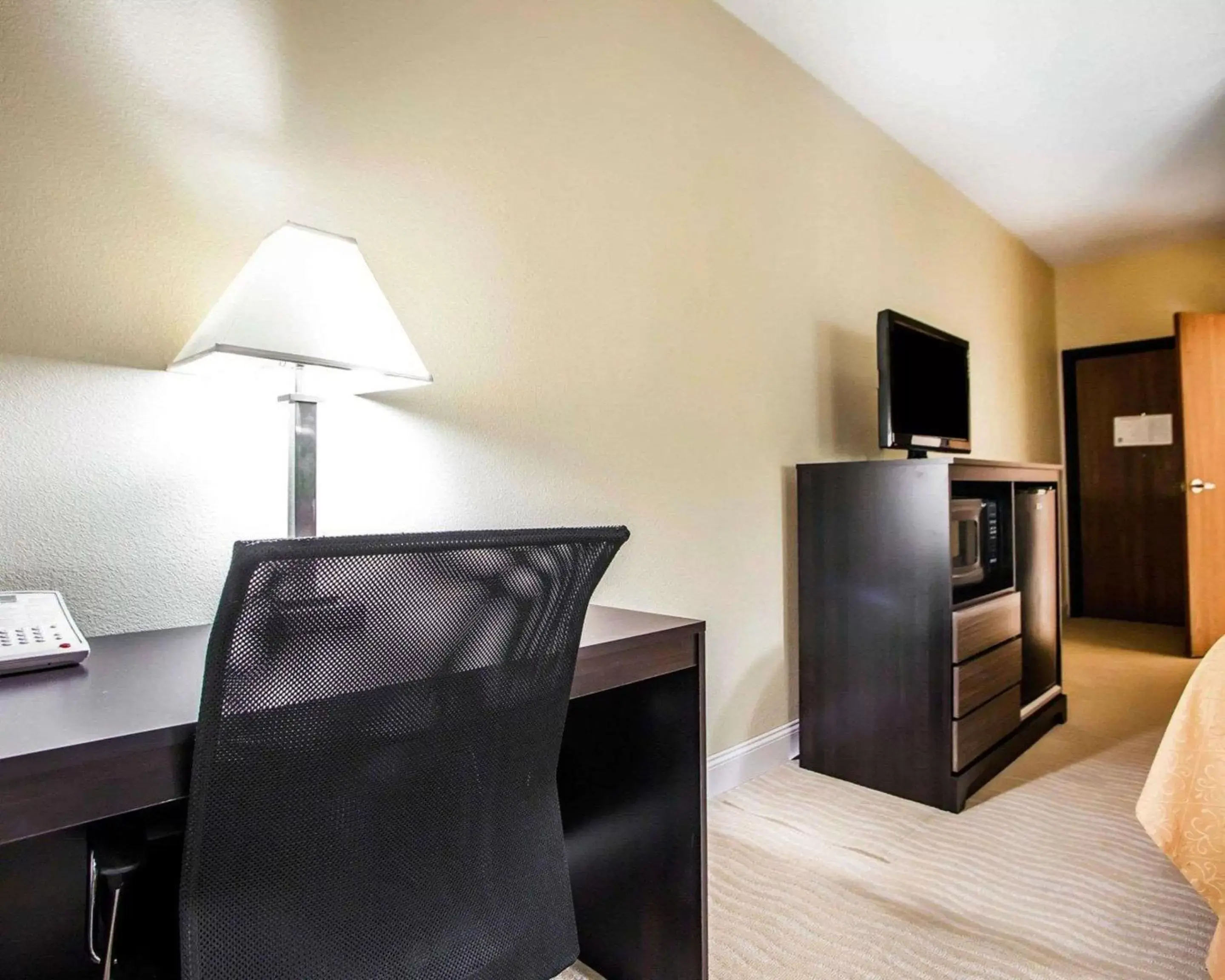 Photo of the whole room, TV/Entertainment Center in Quality Inn & Suites Champaign