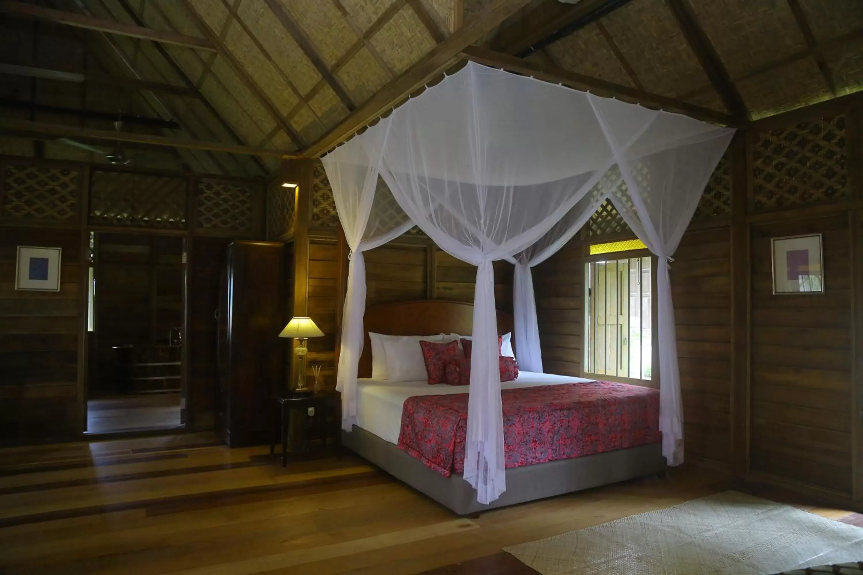 Bed in Kunang Kunang Heritage Villas