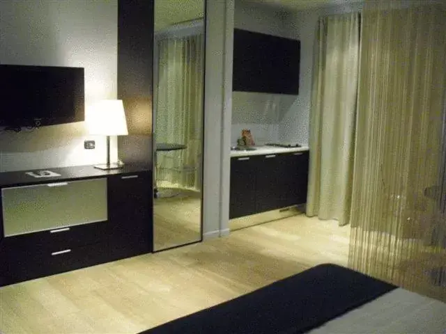 Photo of the whole room, TV/Entertainment Center in Joia Hotel & Luxury Apartments