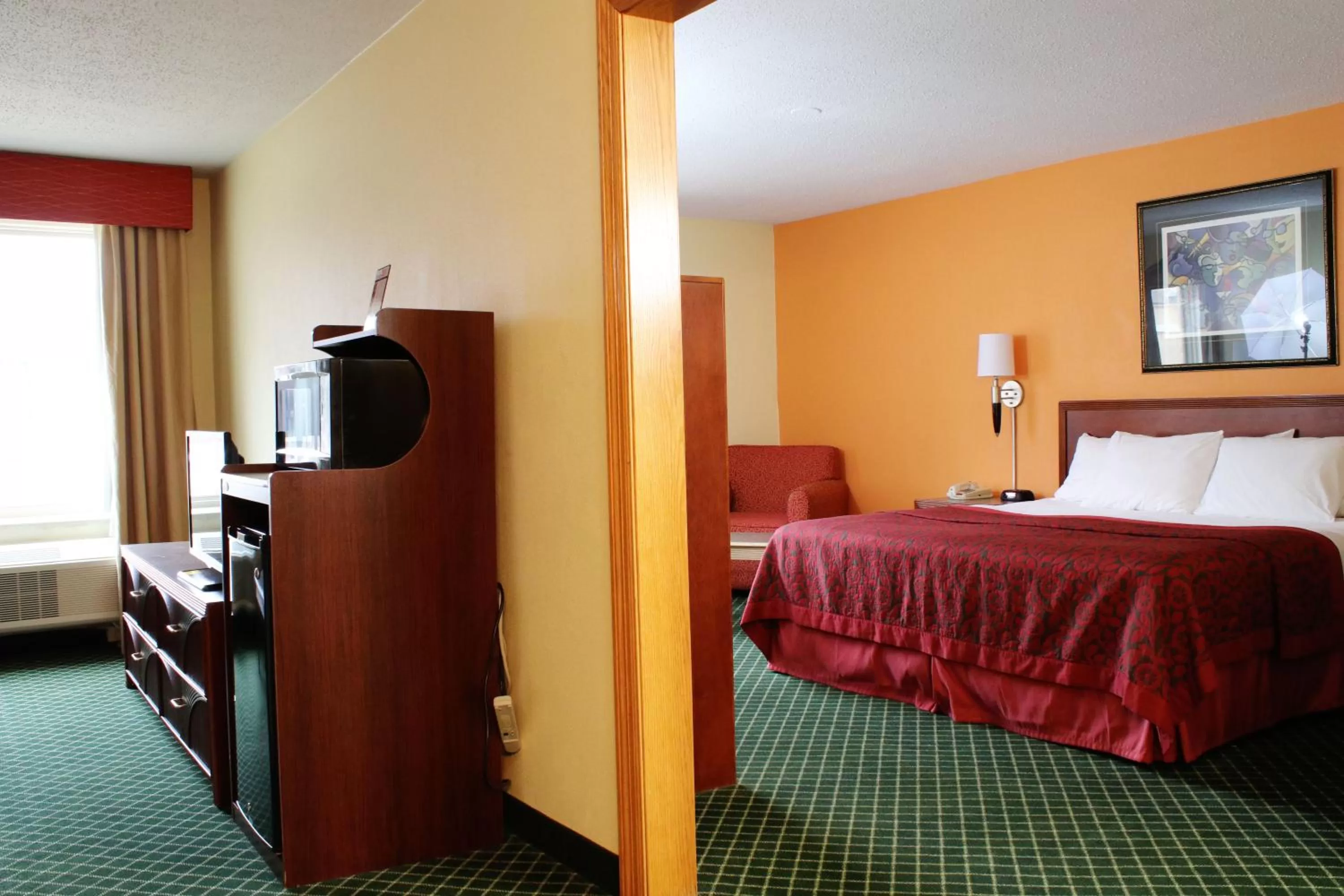 Photo of the whole room, Bed in Days Inn & Suites by Wyndham Bloomington/Normal IL