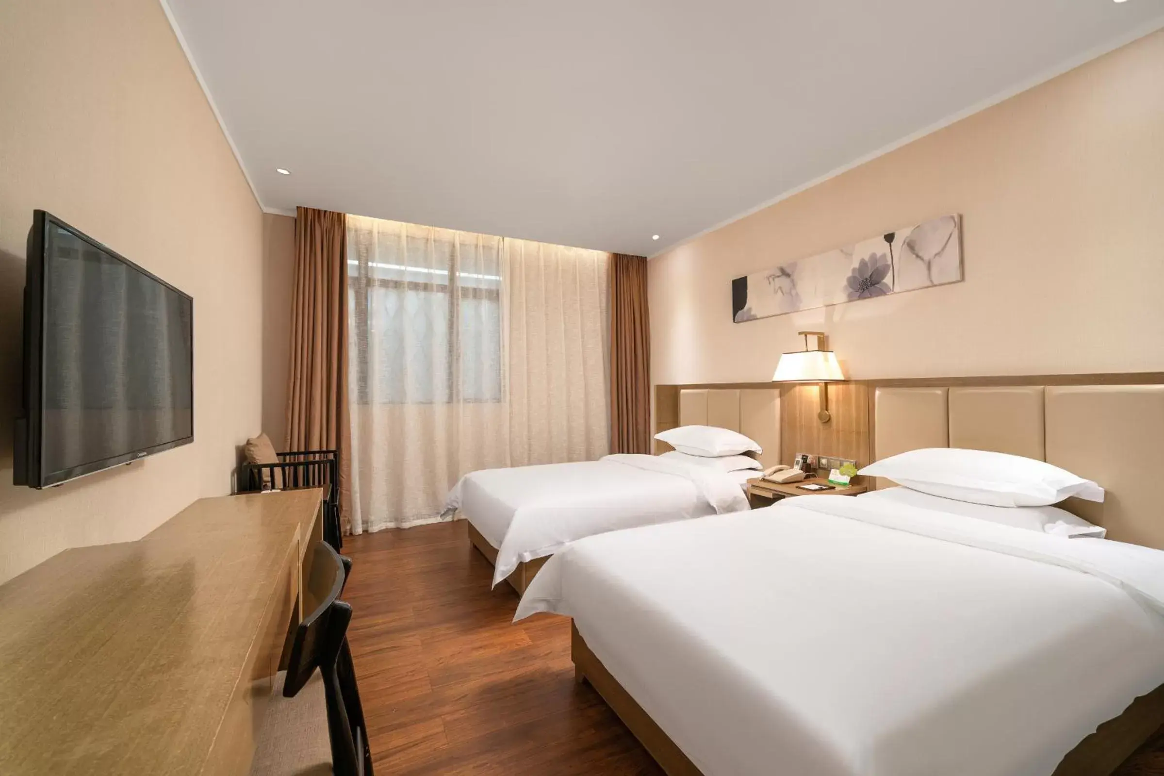 Bed in Guangzhou Boyi Hotel