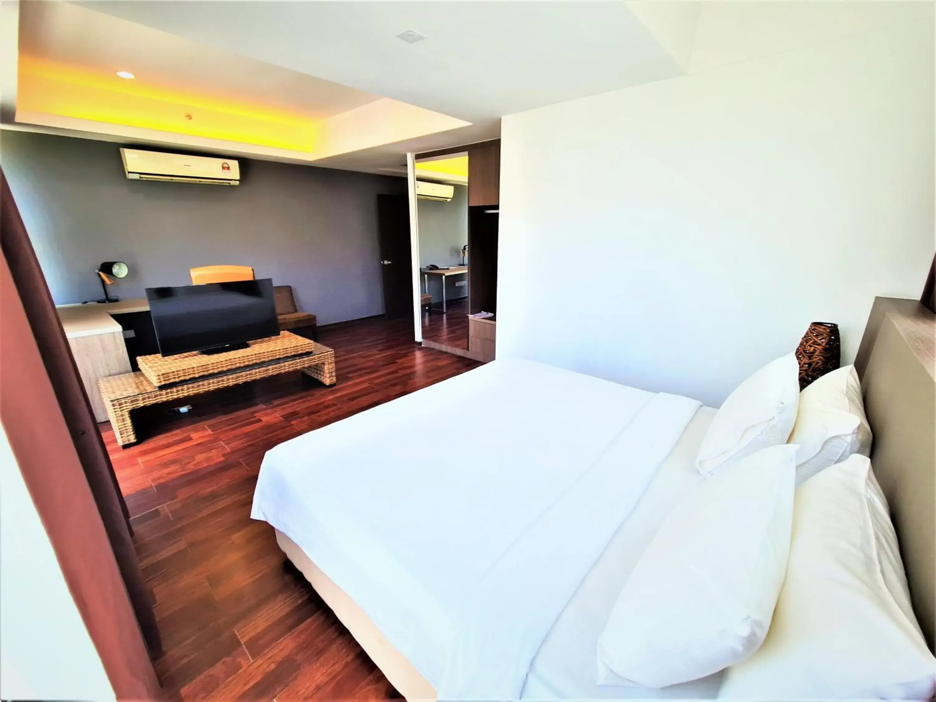 Bed in Nexus Regency Suites & Hotel