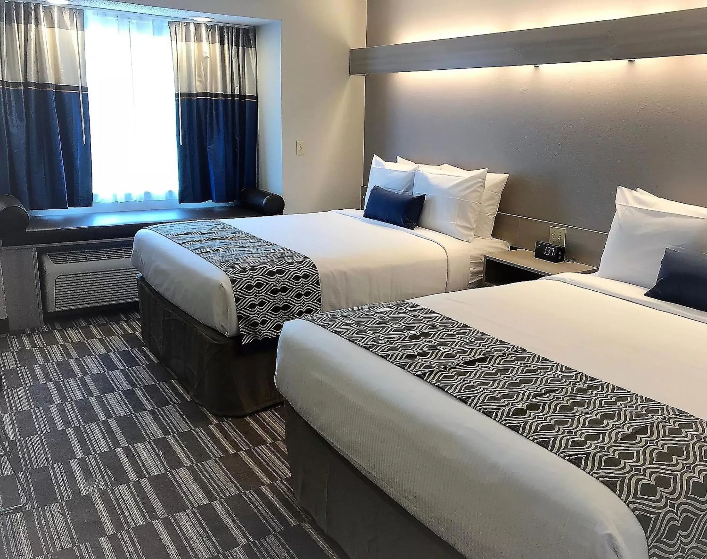 Bed in Microtel Inn & Suites by Wyndham Atlanta Buckhead Area