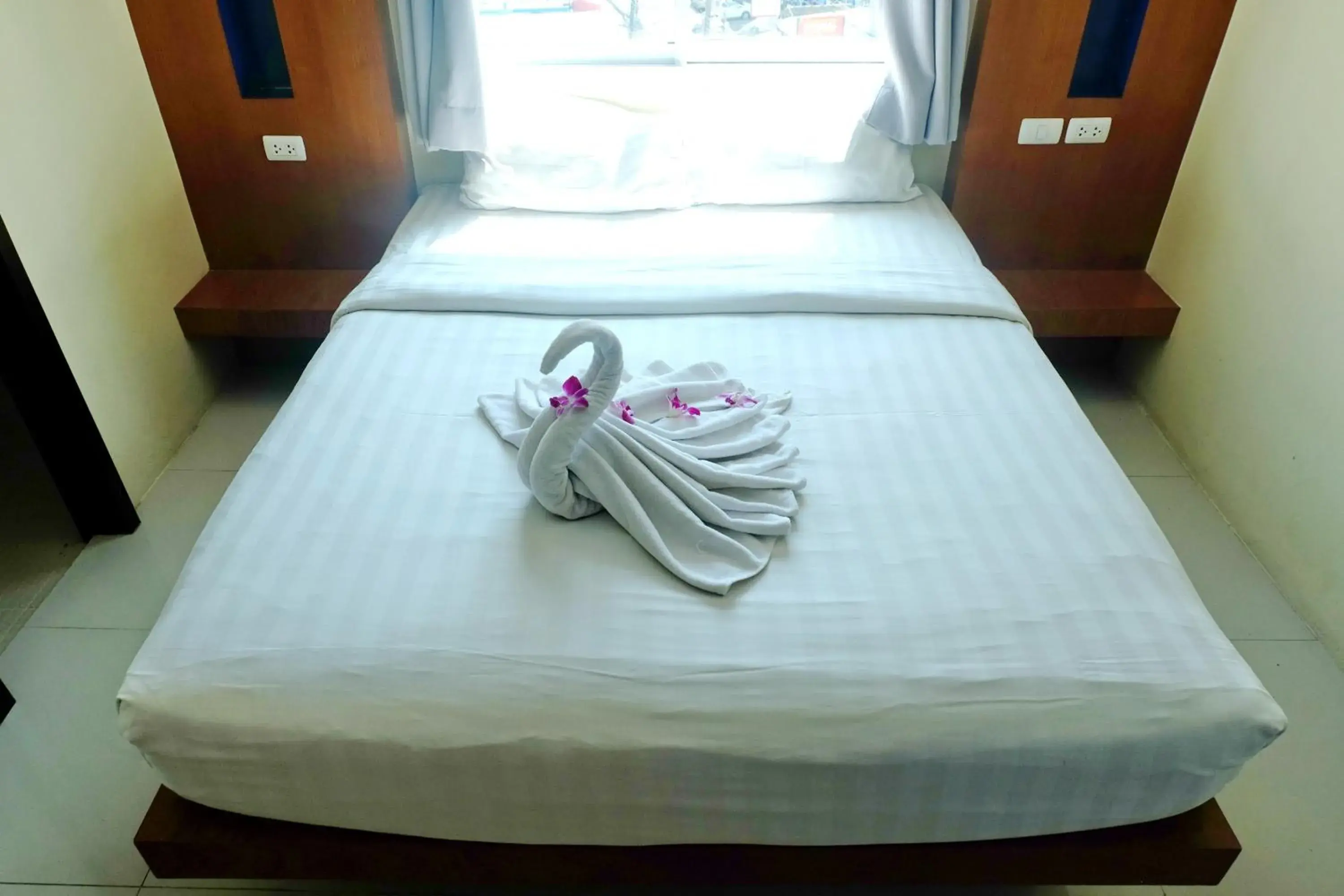 Bed in Calypso Patong Hotel