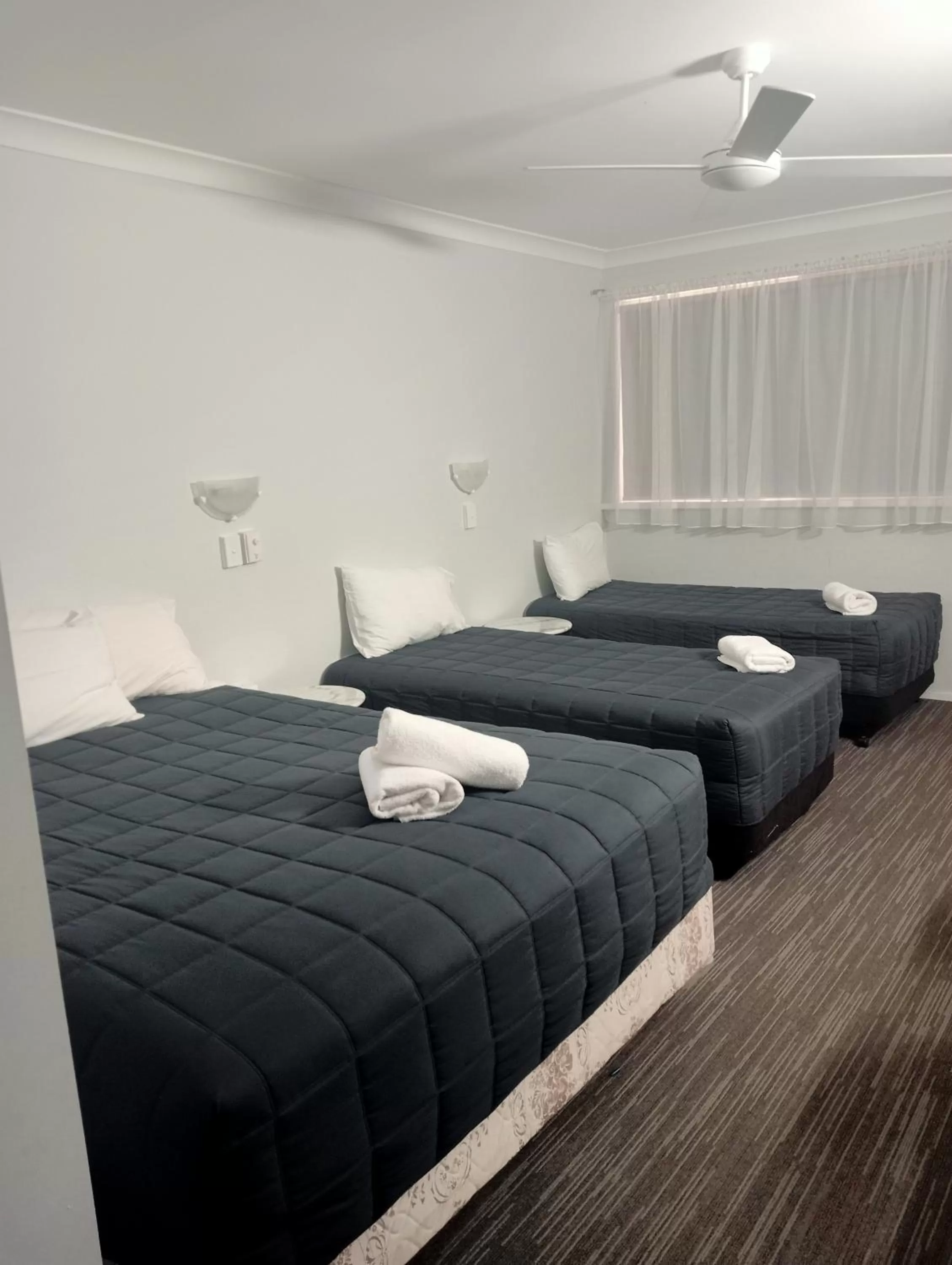 Bed in Forster Palms Motel