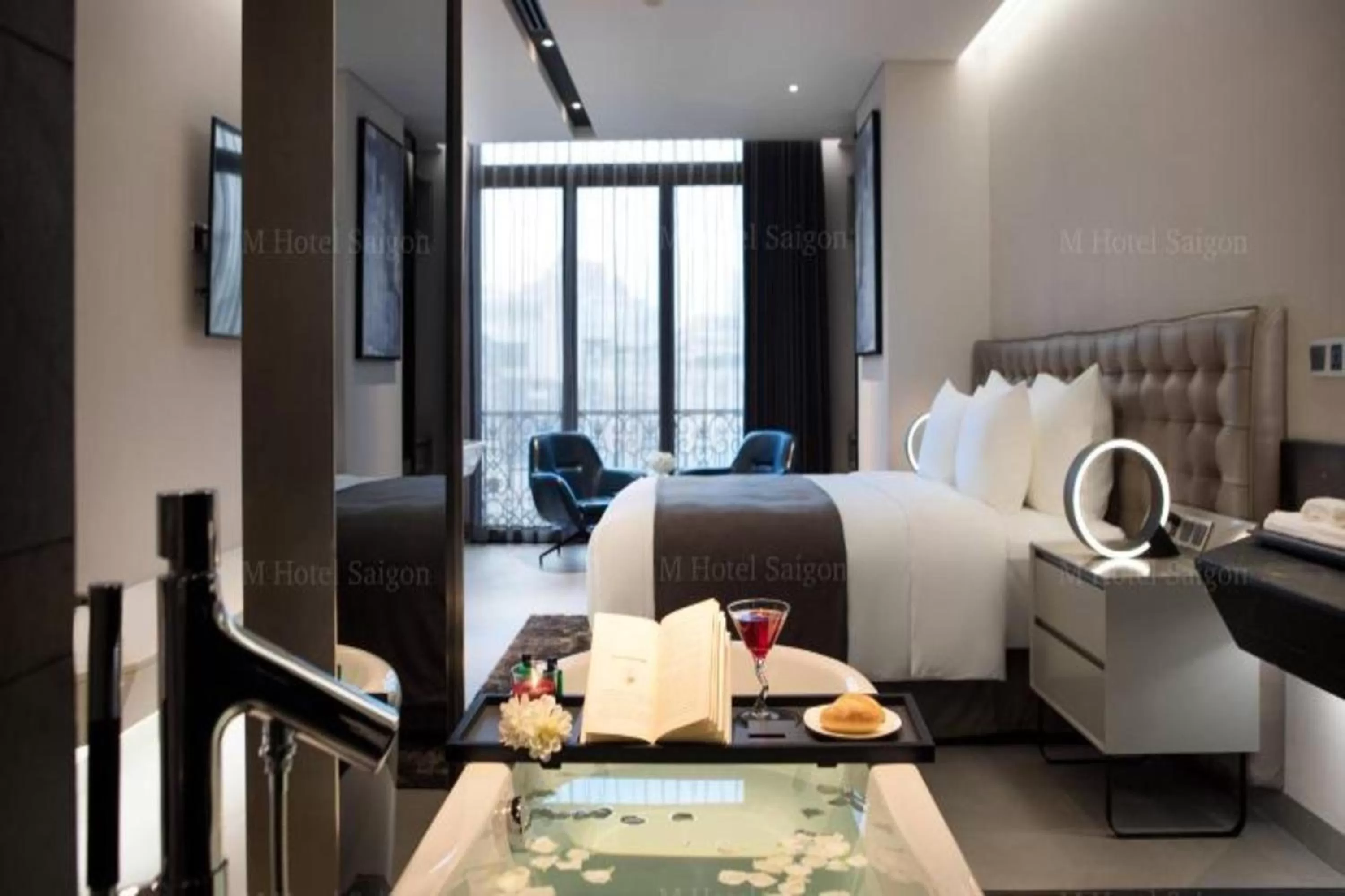 Bath, Bed in M Hotel Saigon