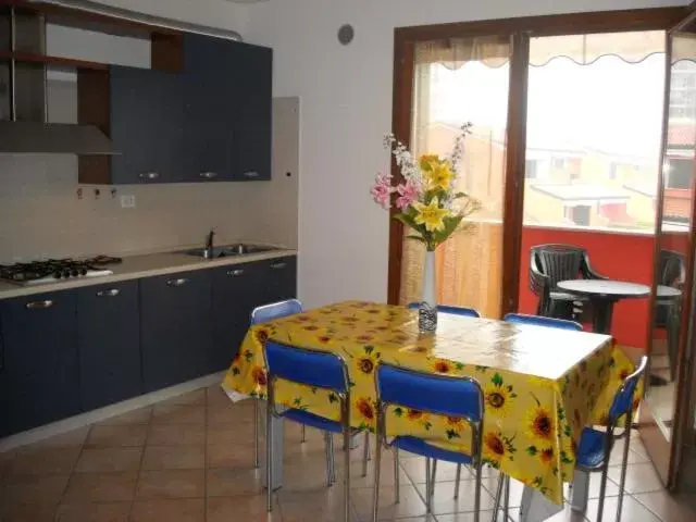 Kitchen/Kitchenette in Villaggio dei Fiori Apart- Hotel 3 Stars - Family Resort