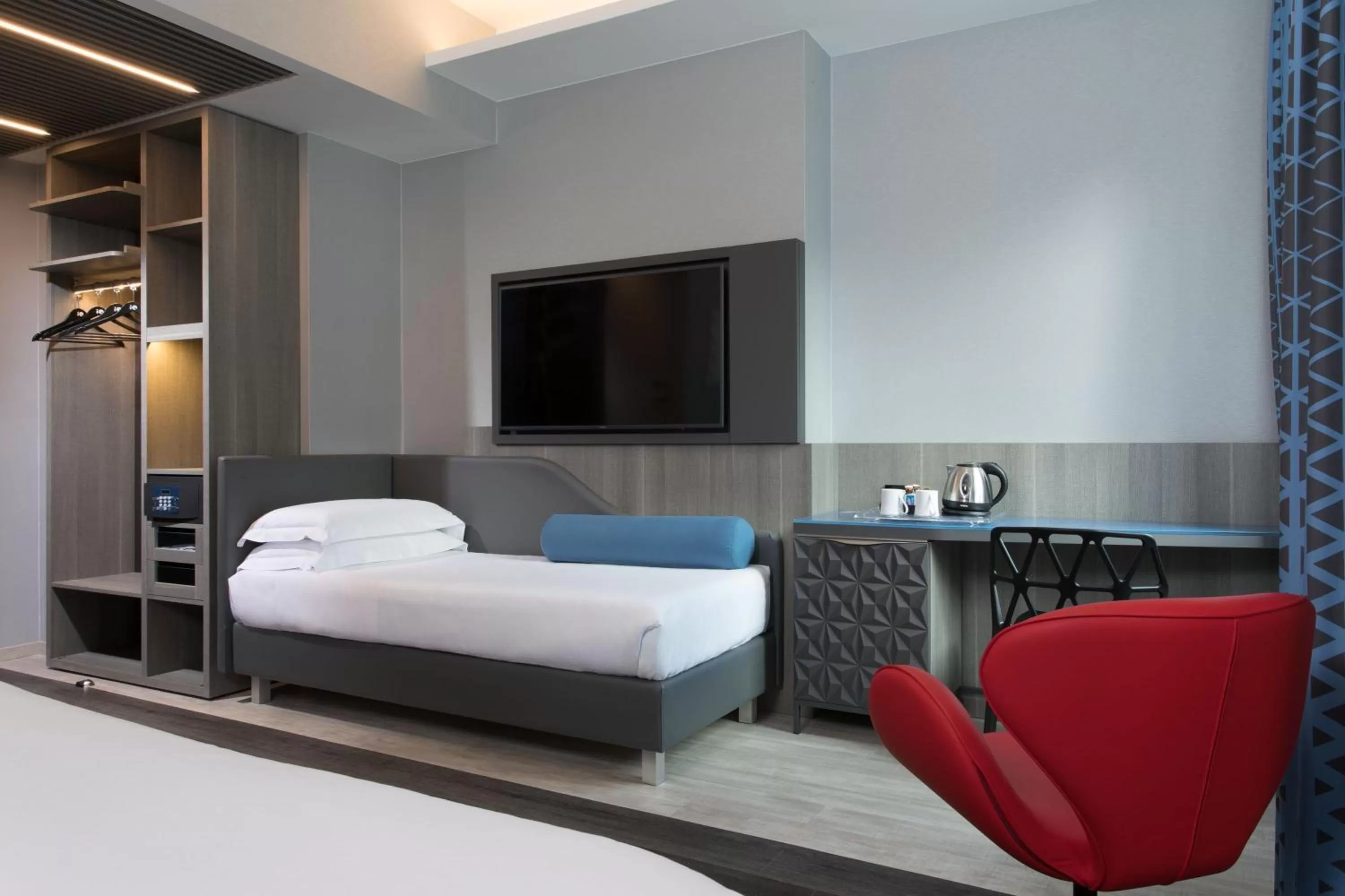 Bed in iQ Hotel Milano