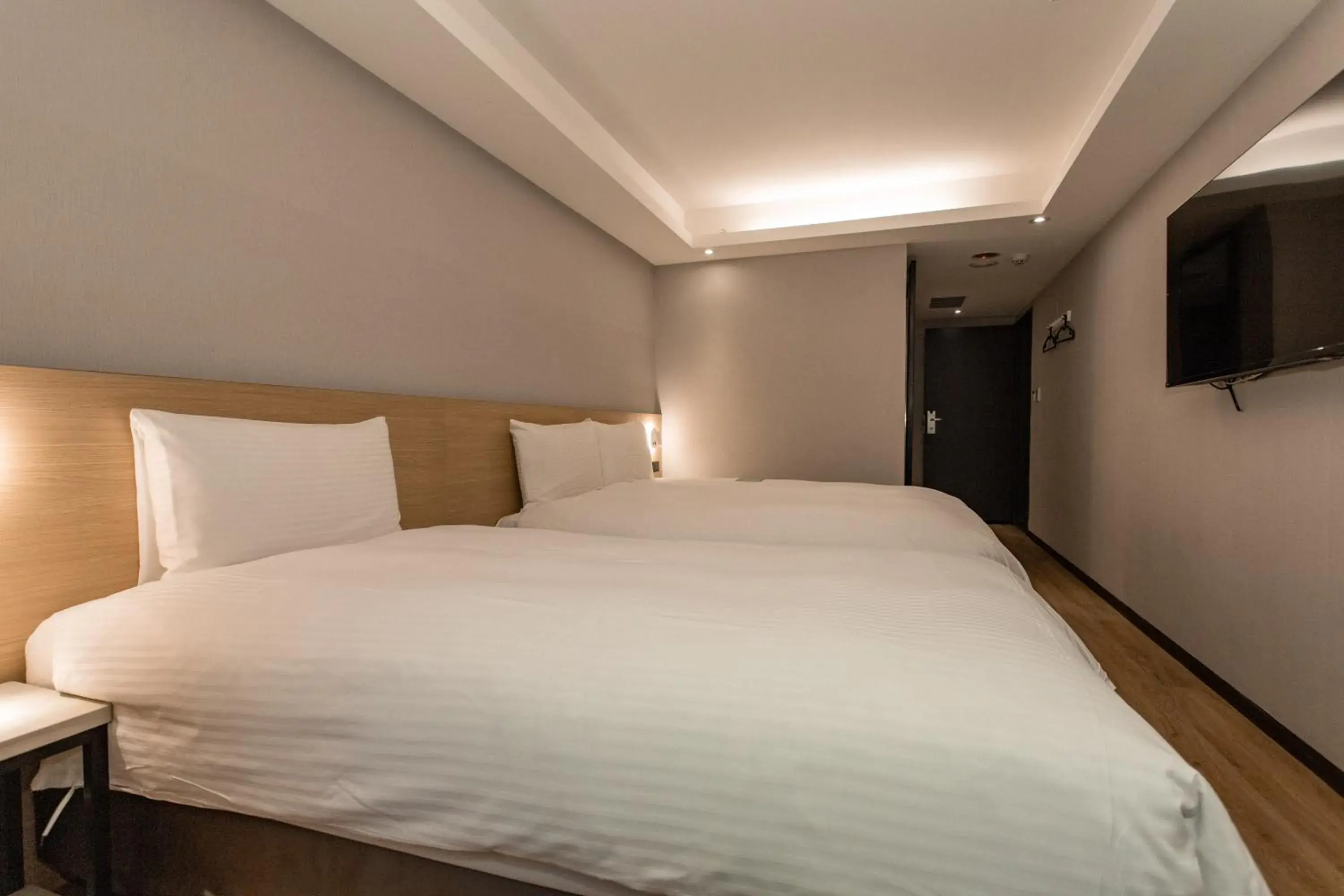 Bed in Hub Hotel Tucheng