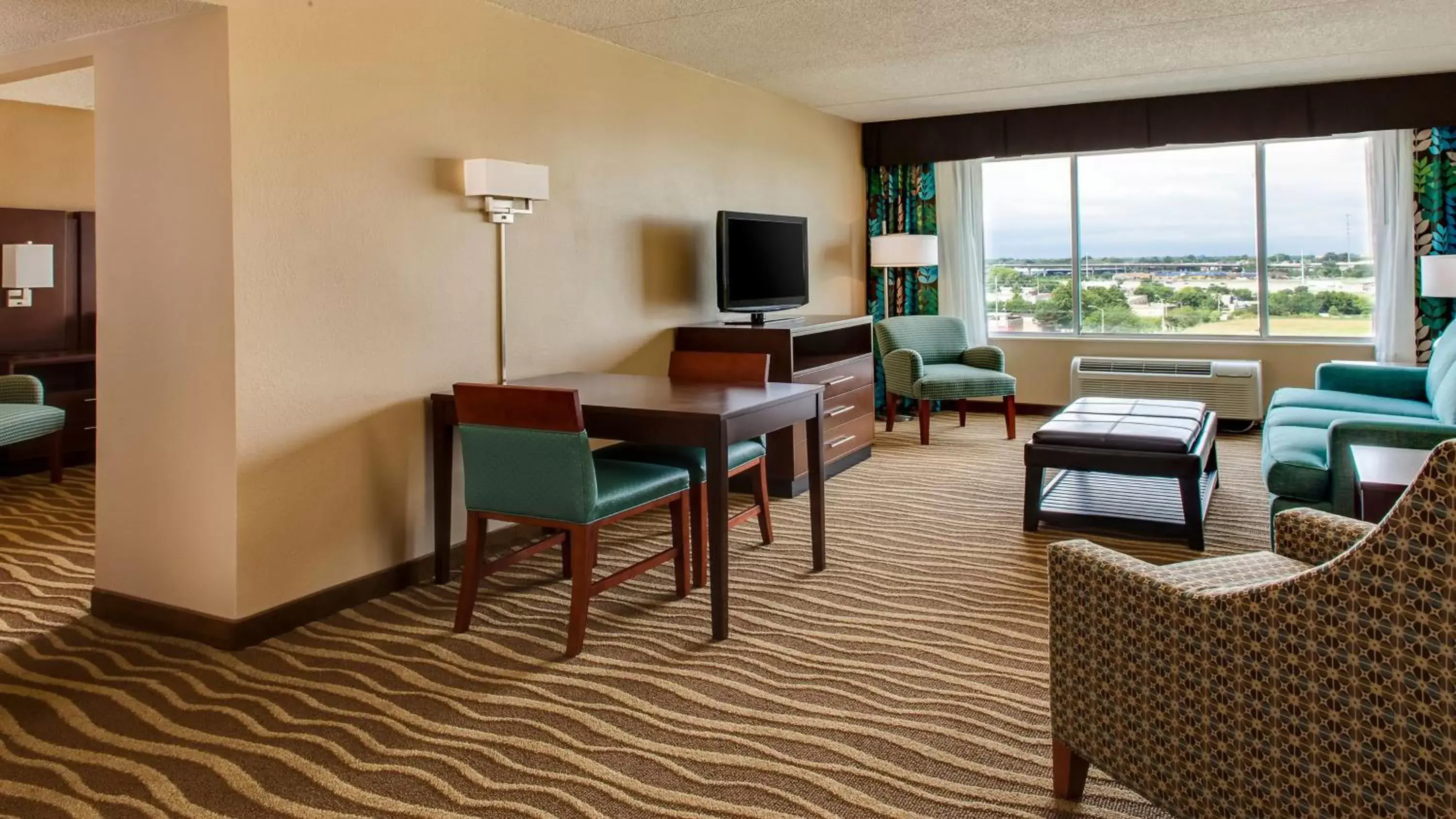 Photo of the whole room, Seating Area in Holiday Inn Hotel & Suites Overland Park-West, an IHG Hotel