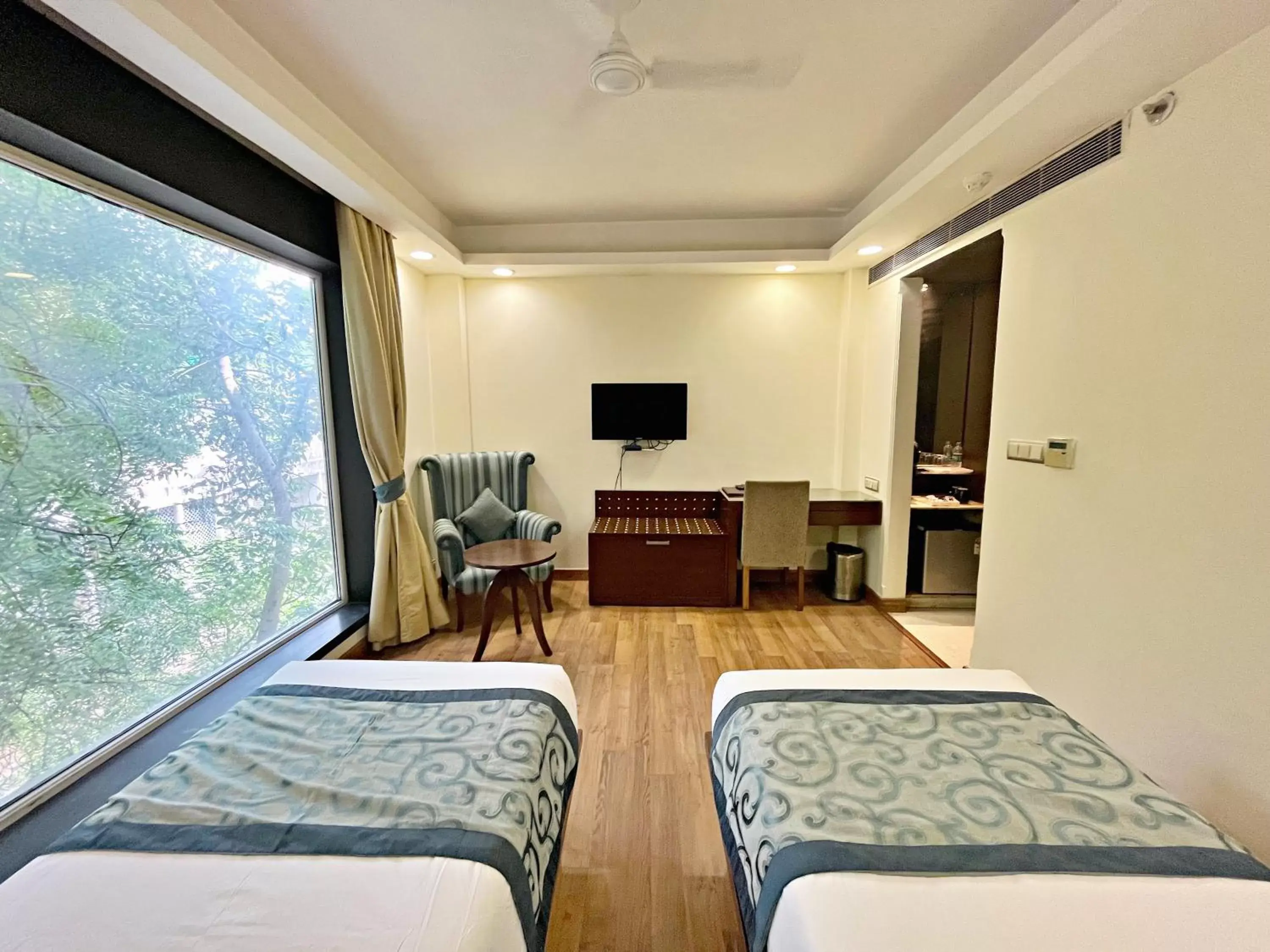 Bed in The Grand Orion - Kailash Colony