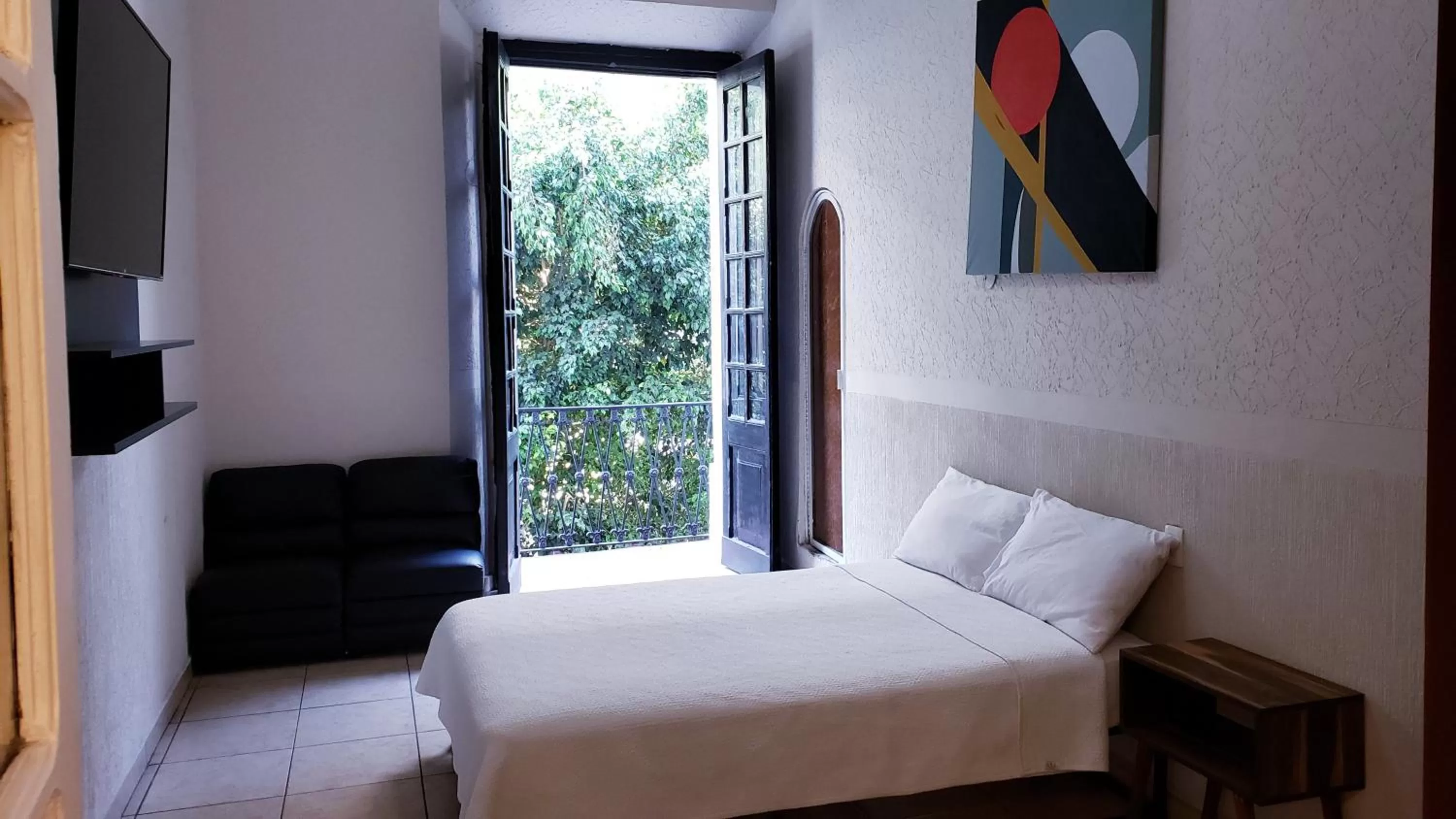 Bed in Hotel Grand Isitia