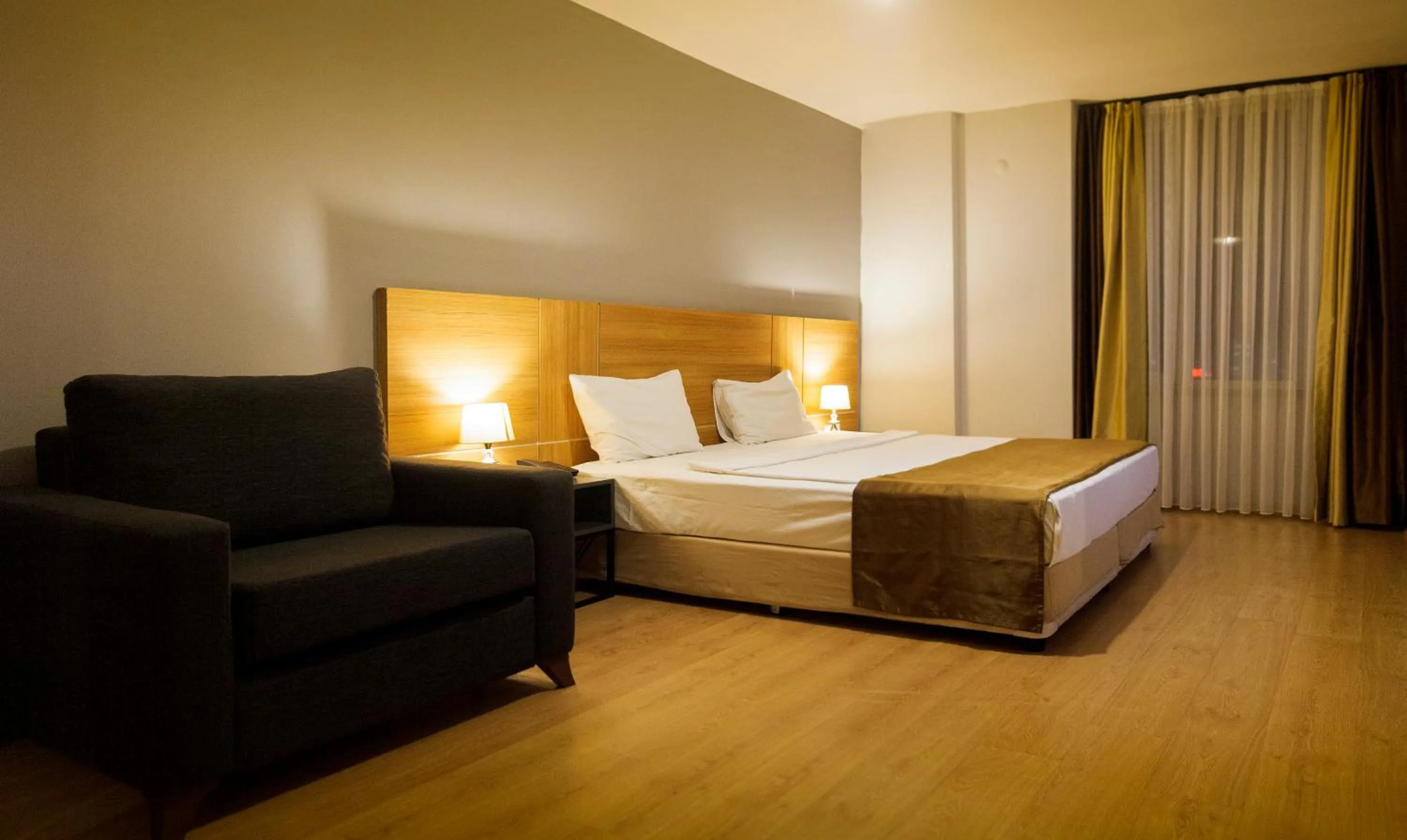 Seating area, Bed in PRIVADO HOTELS