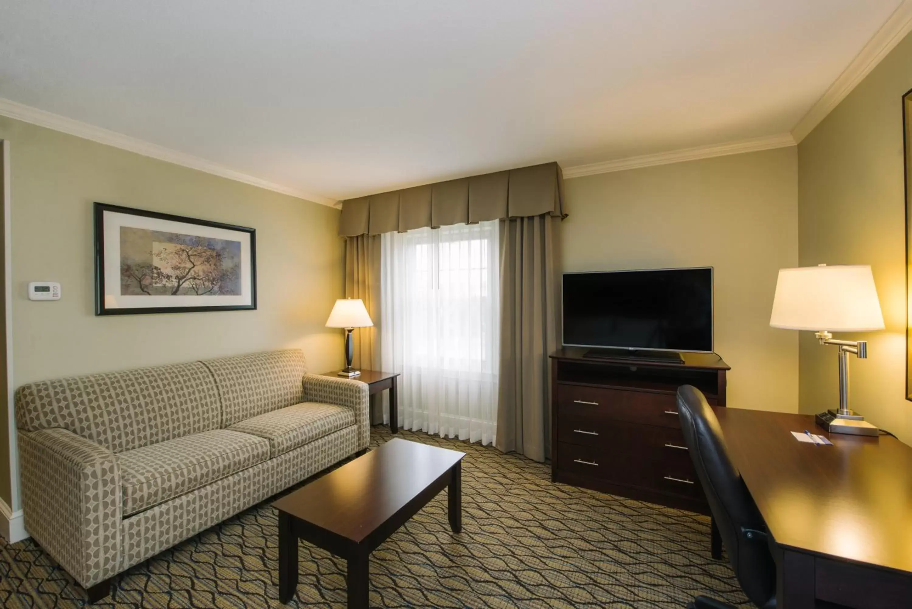 Photo of the whole room, Seating Area in Holiday Inn Express and Suites Merrimack, an IHG Hotel