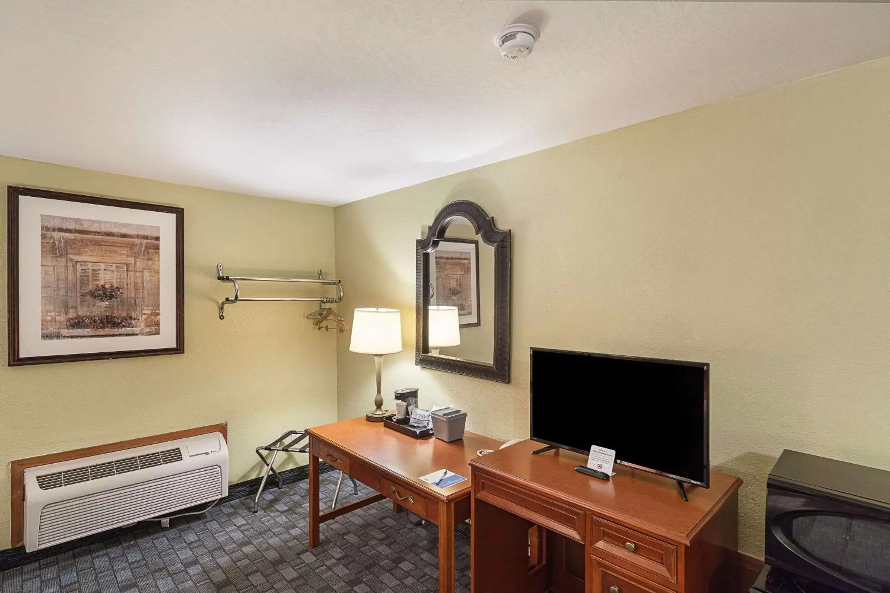 Photo of the whole room, TV/Entertainment Center in Rodeway Inn