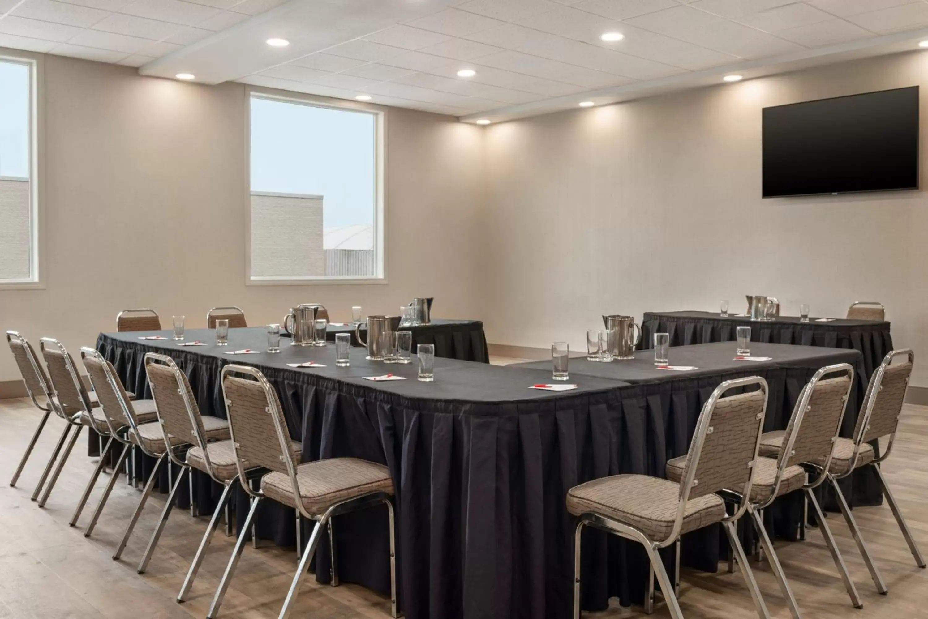 Meeting/conference room in Ramada by Wyndham Airdrie Hotel & Suites