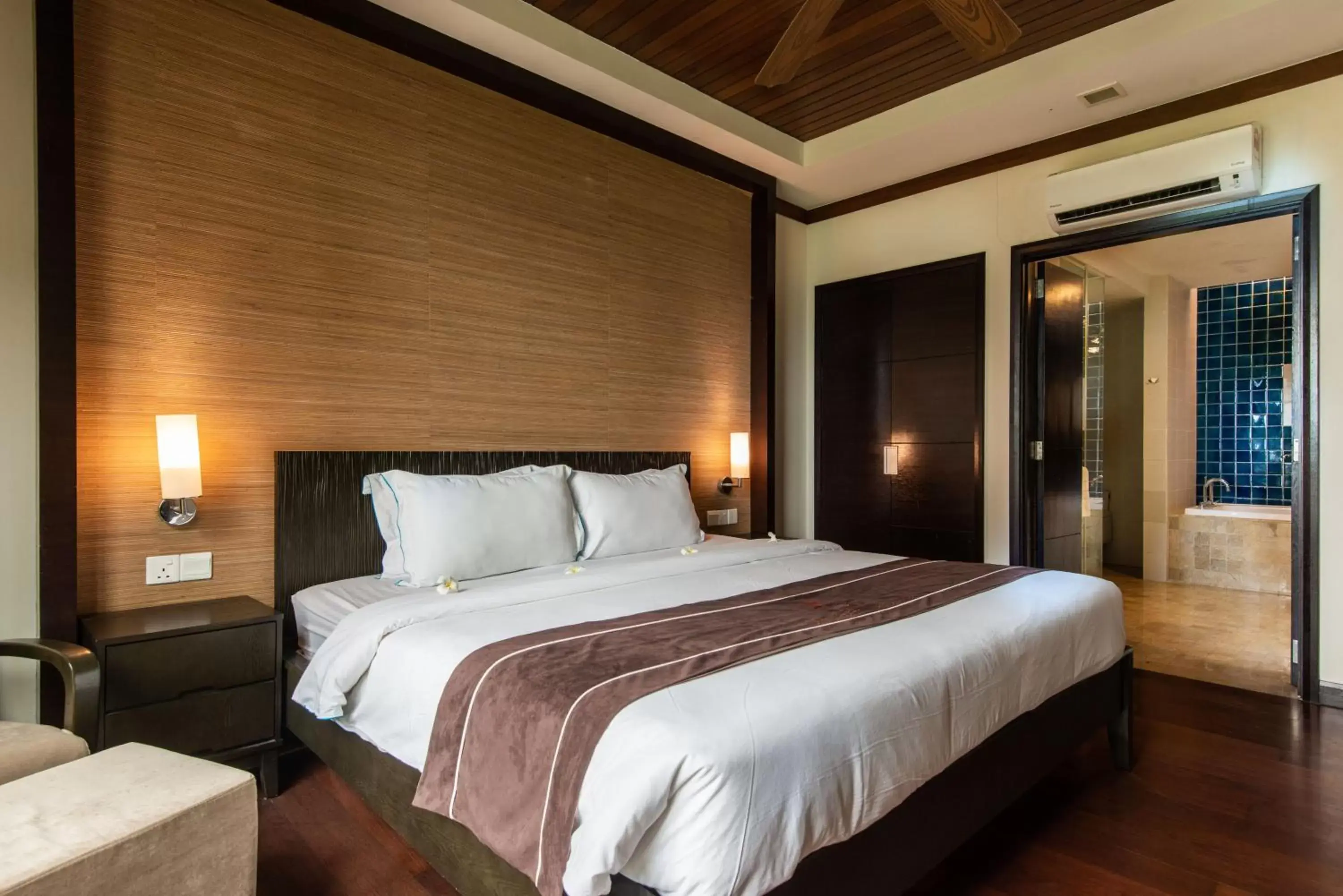 Bed in Sabah Beach Villas & Suites