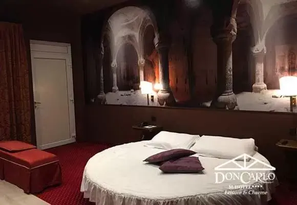 Bed in Hotel Don Carlo