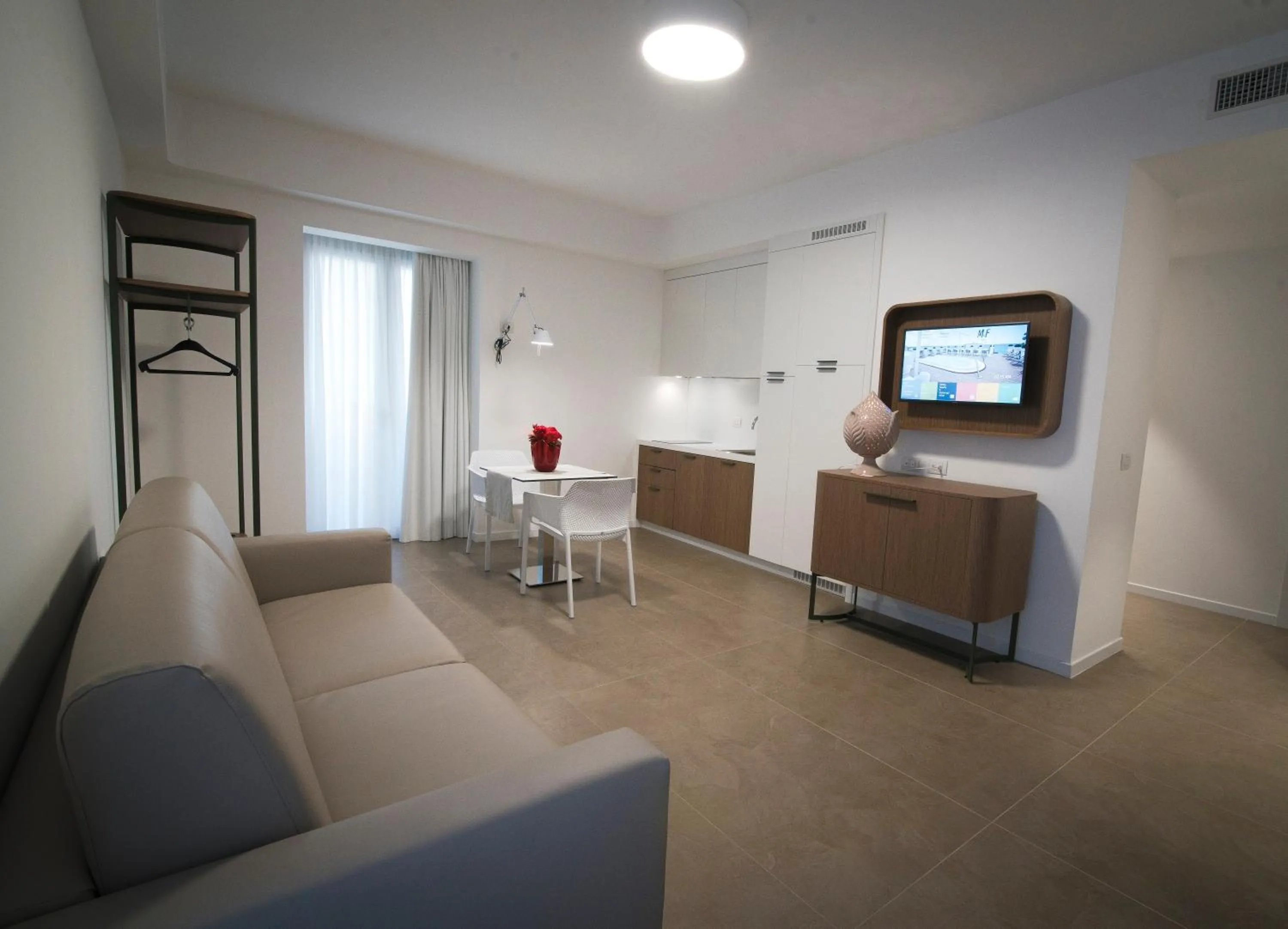 Seating area, Bed in M&F Hotel