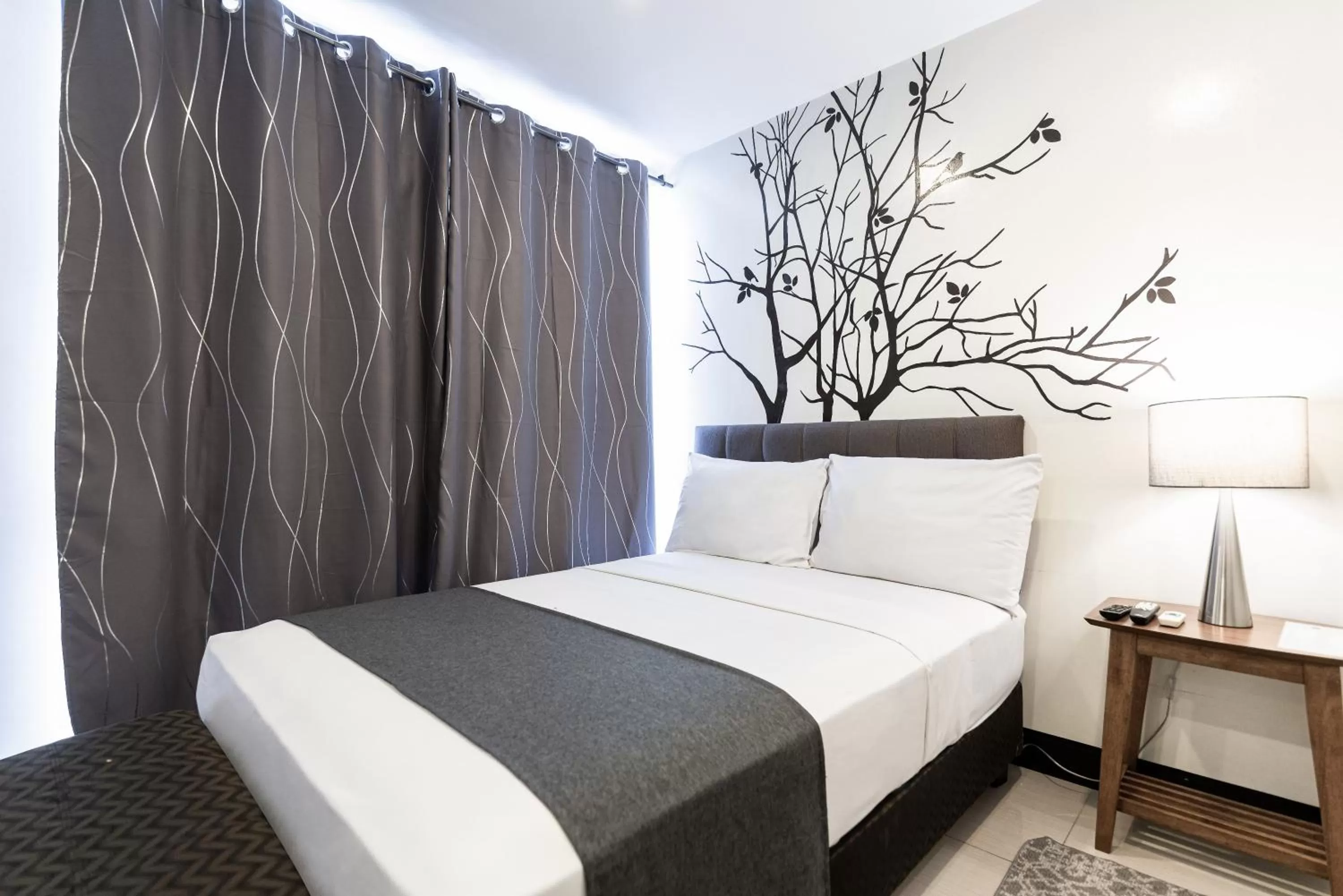 Bedroom, Bed in Artemis Place Makati Hotel