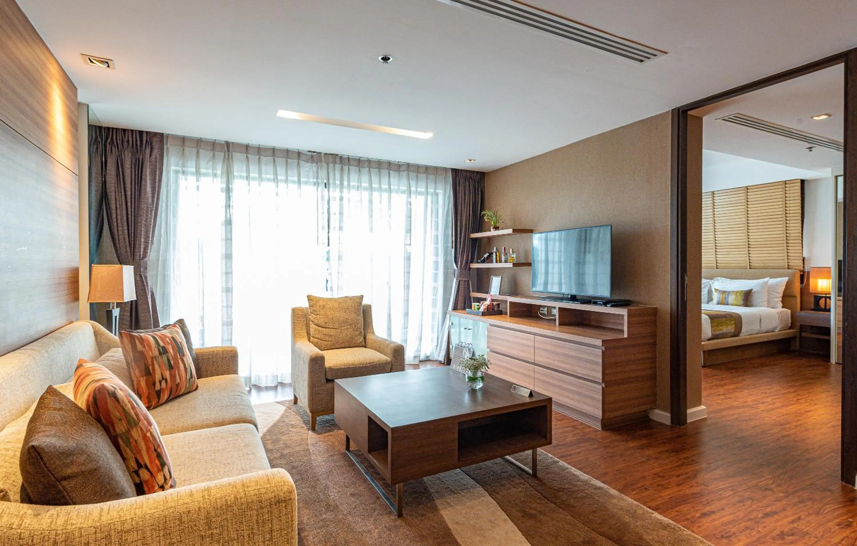Living room, Bed in Summit Windmill Golf Suite Hotel at Suvarnabhumi