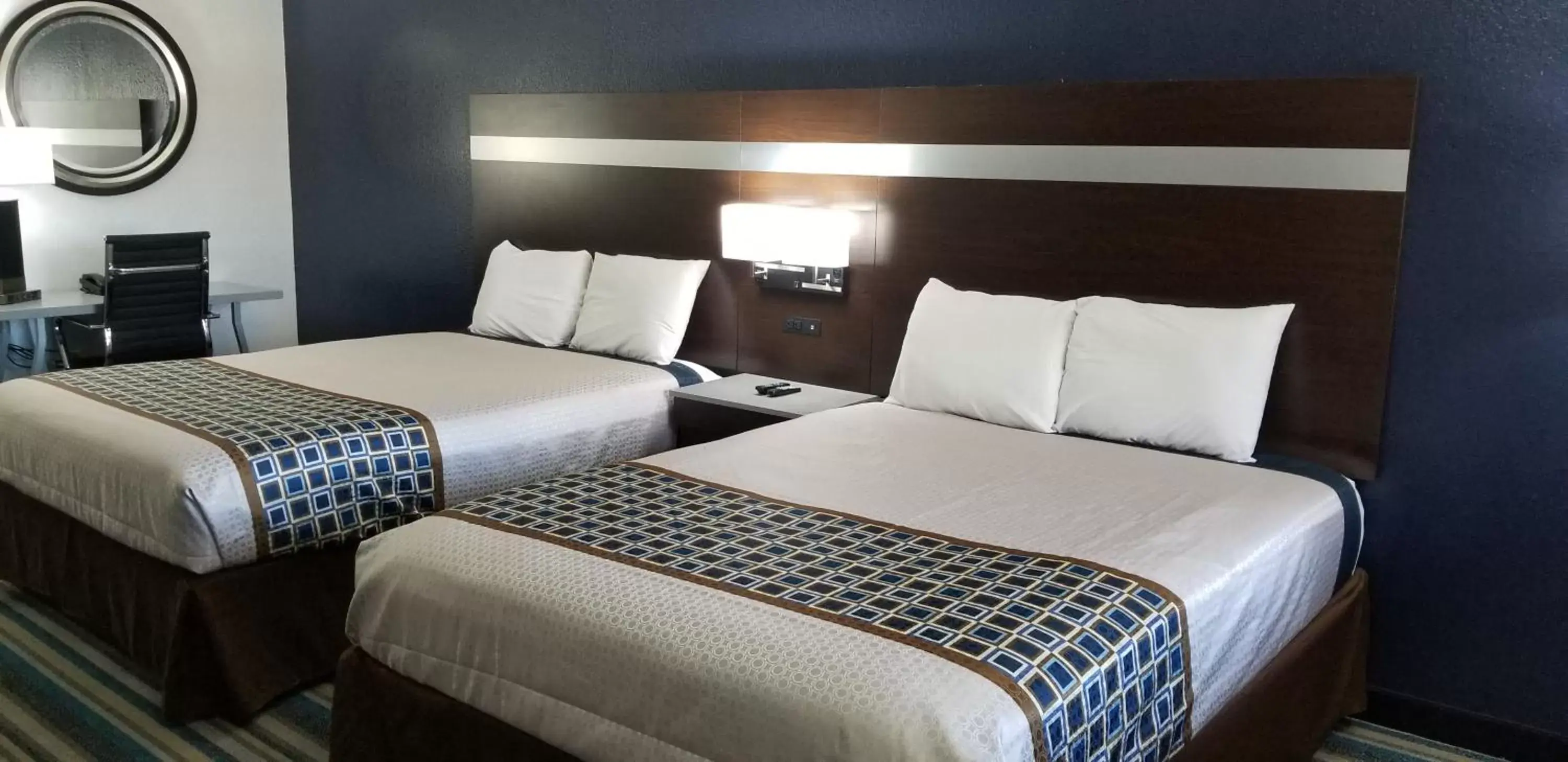 Bed in HomeBridge Inn and Suites Bed in HomeBridge Inn and Suites