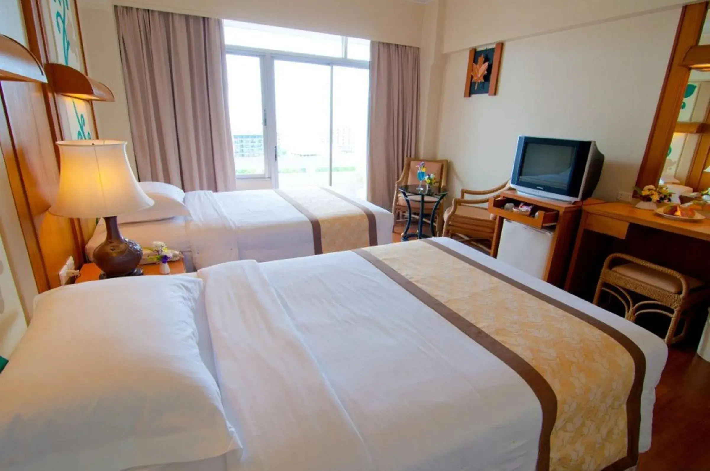 Bed in Golden Beach Hotel Pattaya