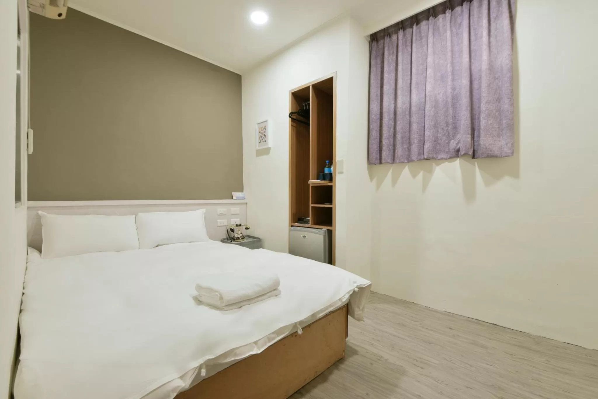 Bed in Raise Hotel Taichung