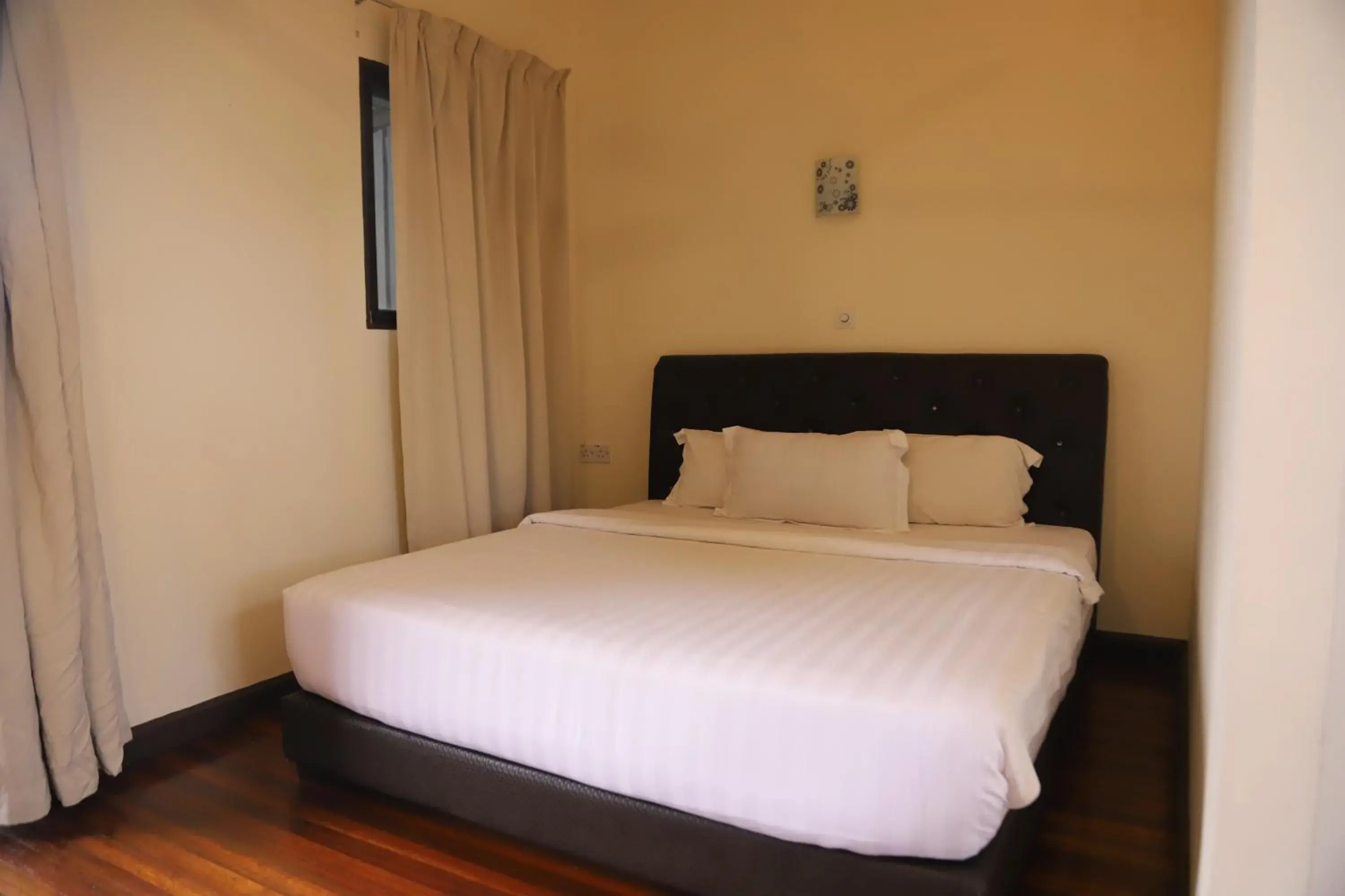 Bed in Kasih Sayang Hill Resort