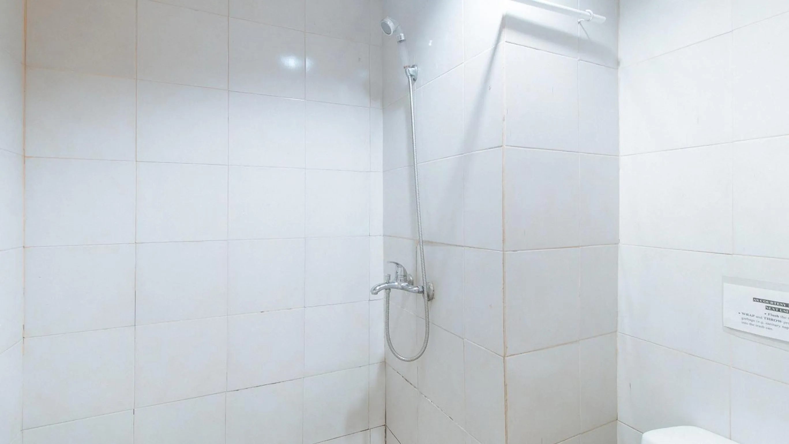 Shower in RedDoorz at Crowne One Condo