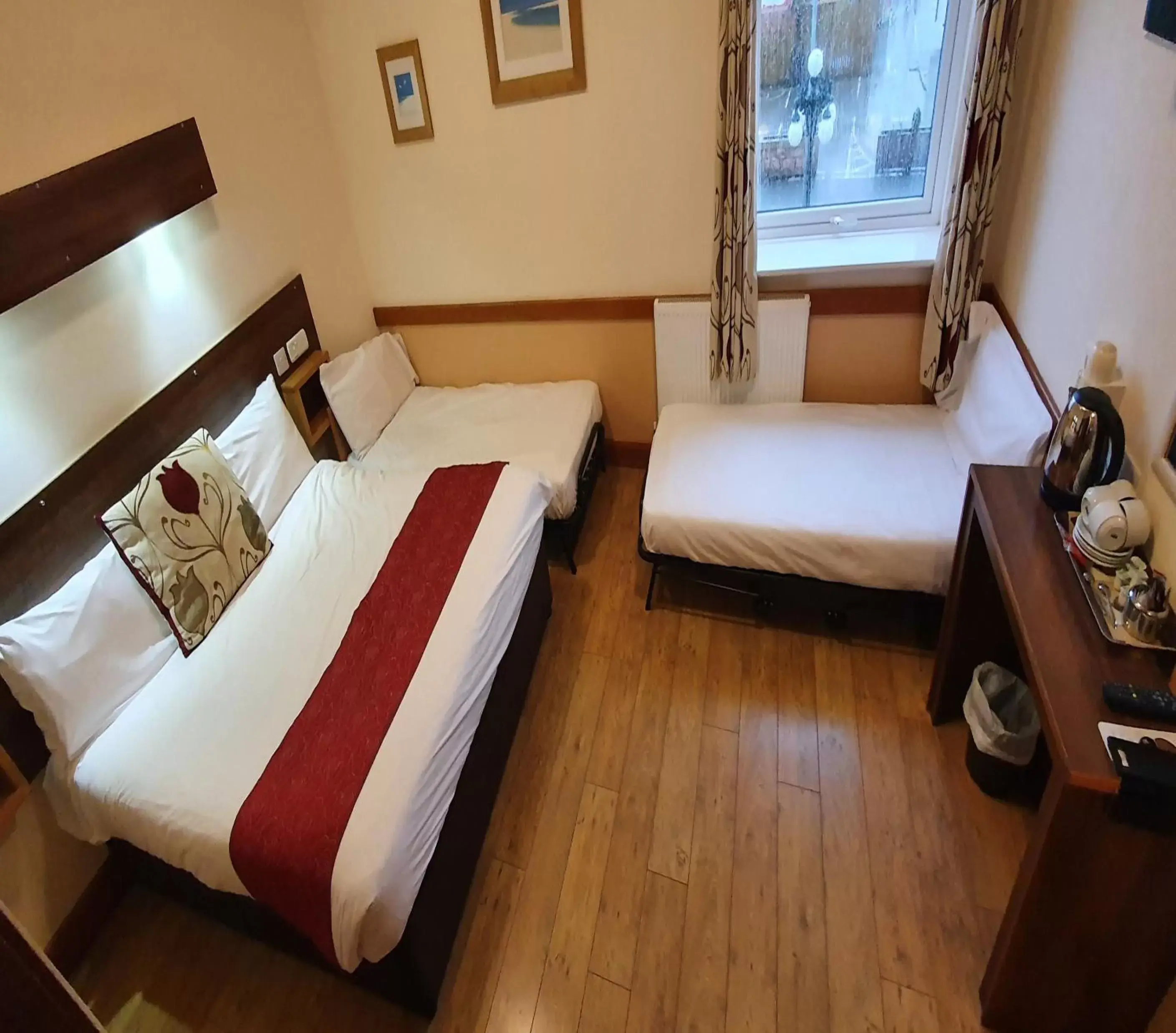 Bed in Villager Hotel