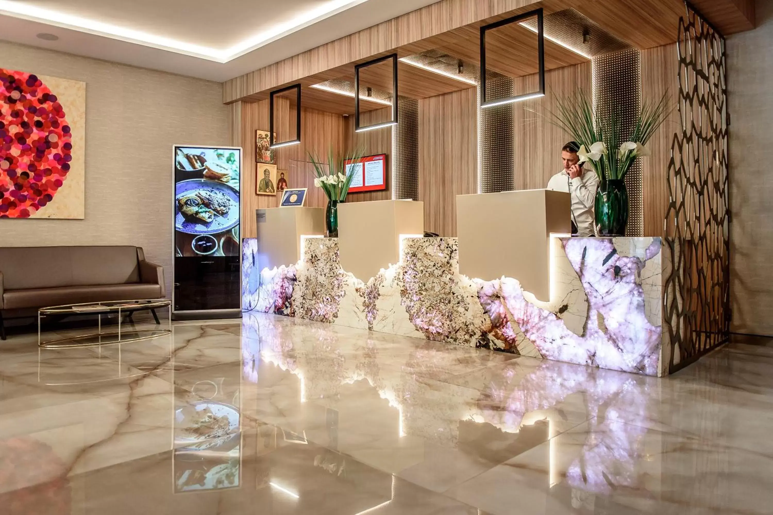 Lobby or reception in Ramada by Wyndham Ramnicu Valcea Lobby or reception in Ramada by Wyndham Ramnicu Valcea