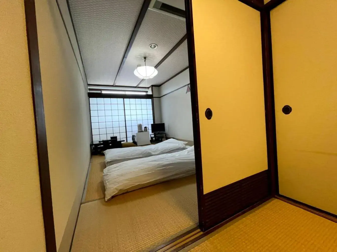 Bed in Kyotoya Hotel