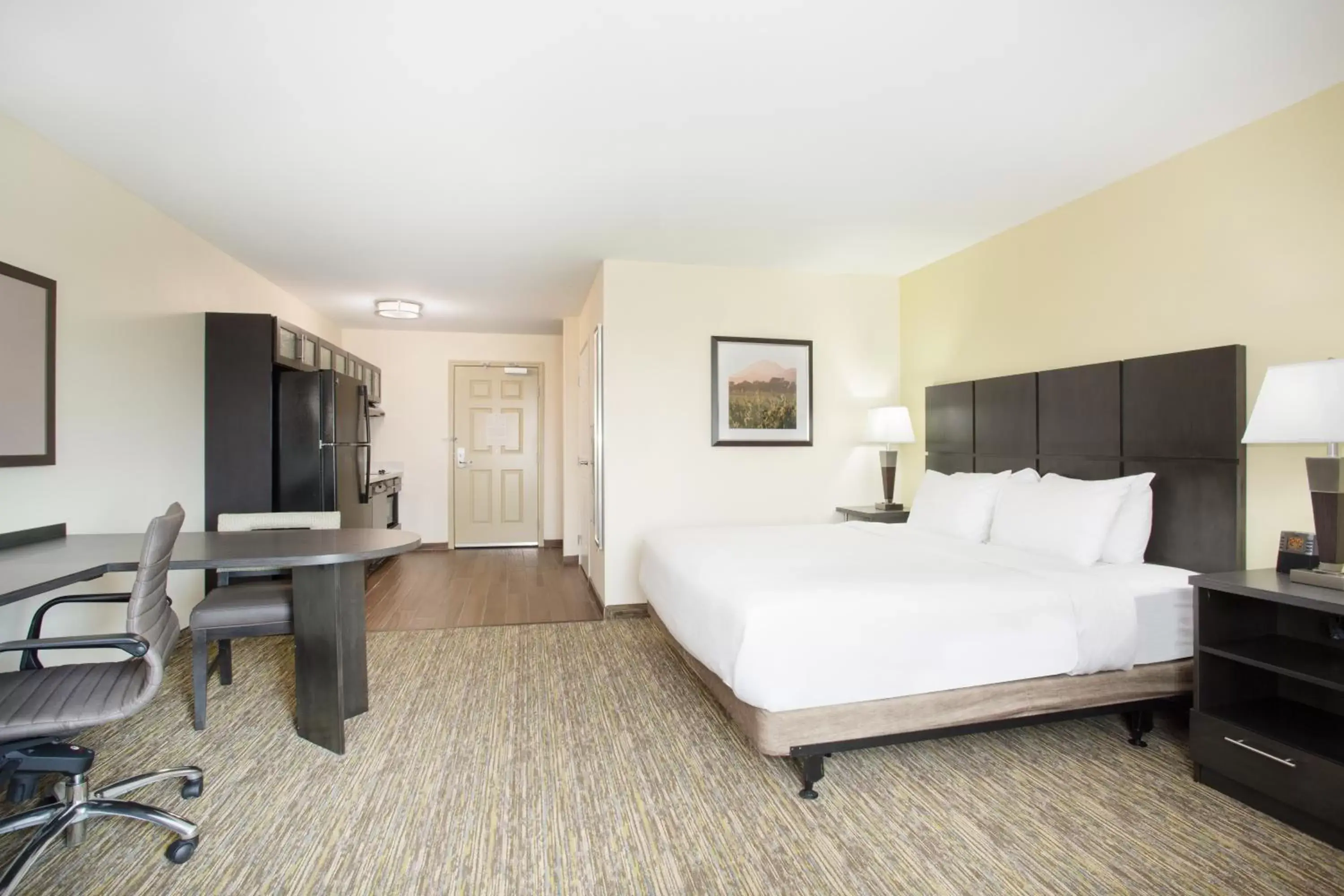 Bedroom in Candlewood Suites Longmont, an IHG Hotel