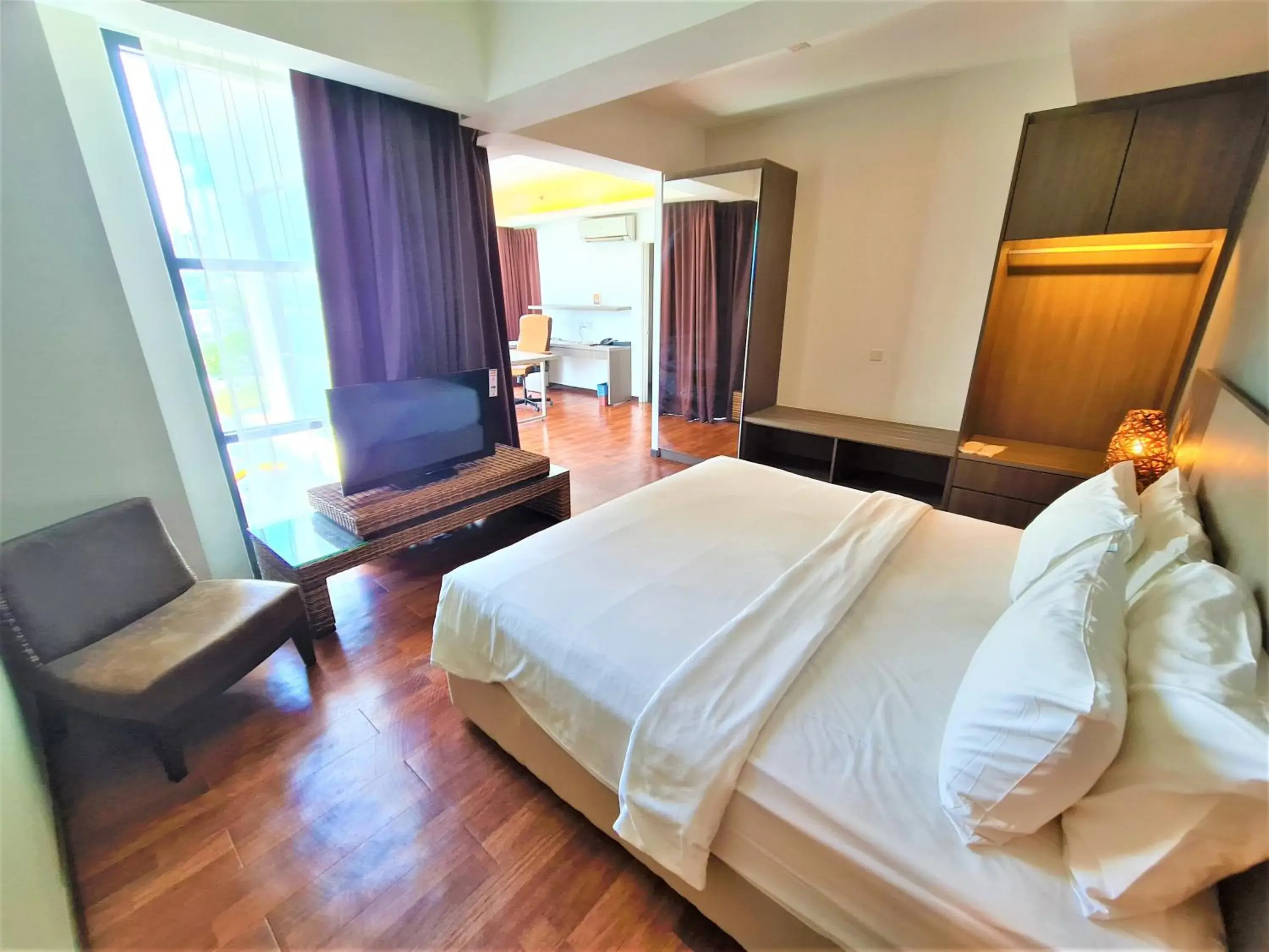 Bed in Nexus Regency Suites & Hotel