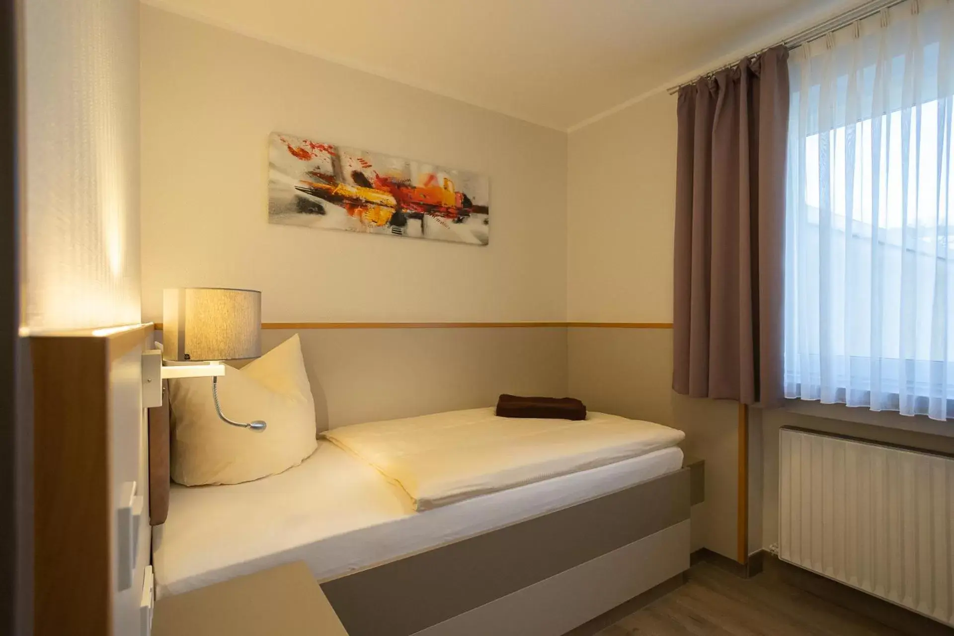 Bed in Stadt-gut-Hotel Siegboot